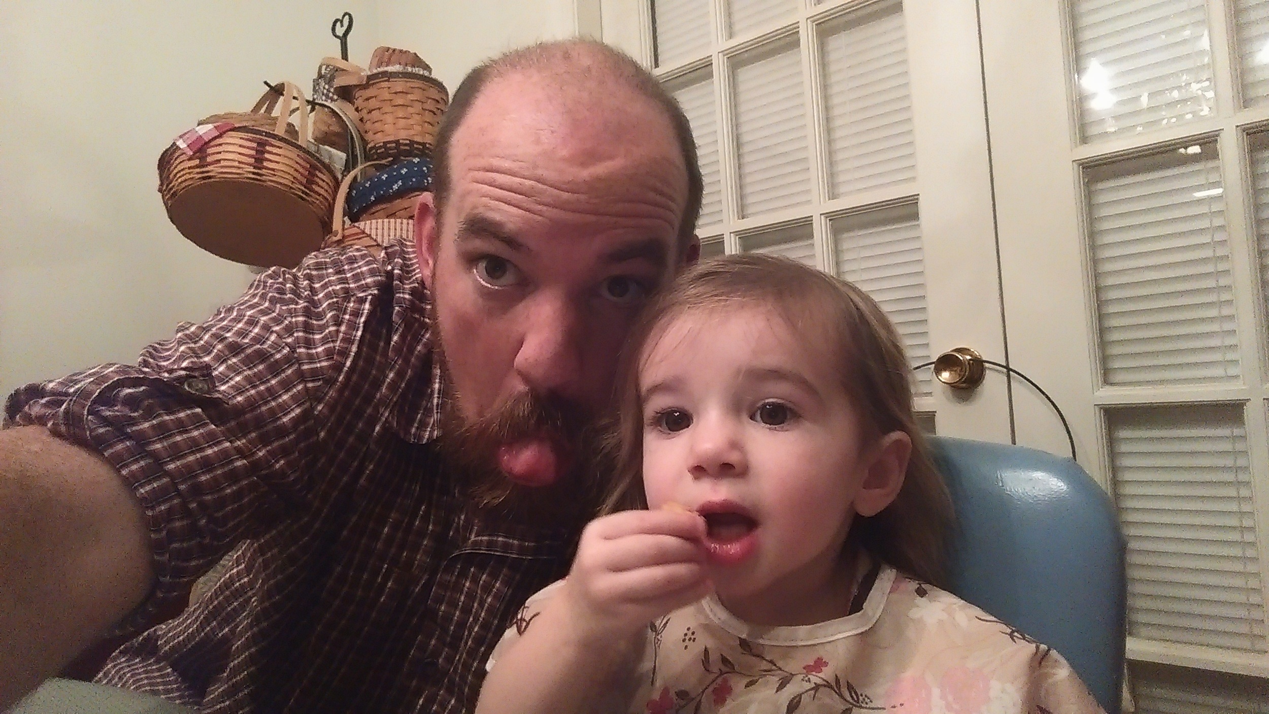 Daddy and Cece goofing off at dinner