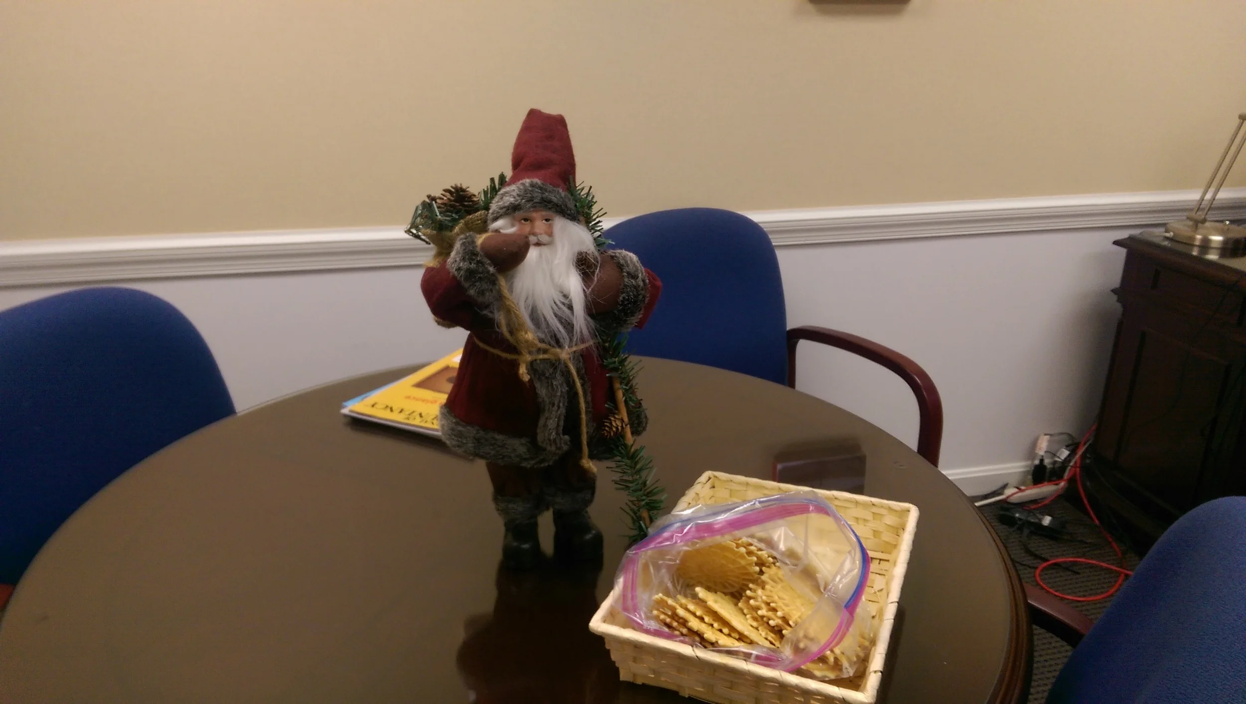 Santa guarding the pizzelles in my office.