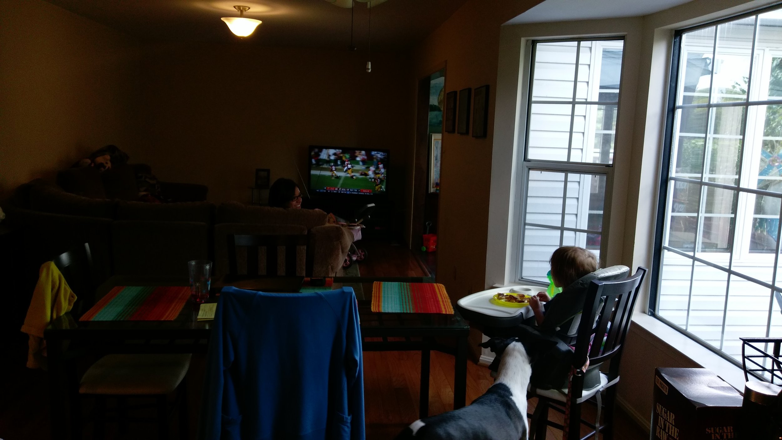 Girls watch football while I wash dishes