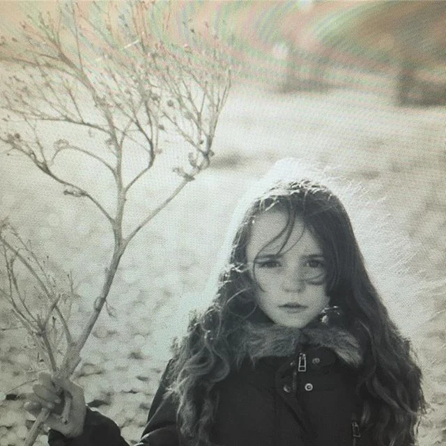 Screengrab : my little one holding a stick she found on the beach #daughter #beach #love #cinematic #winter #winterlight #suffolk #driftwood #sea #canon