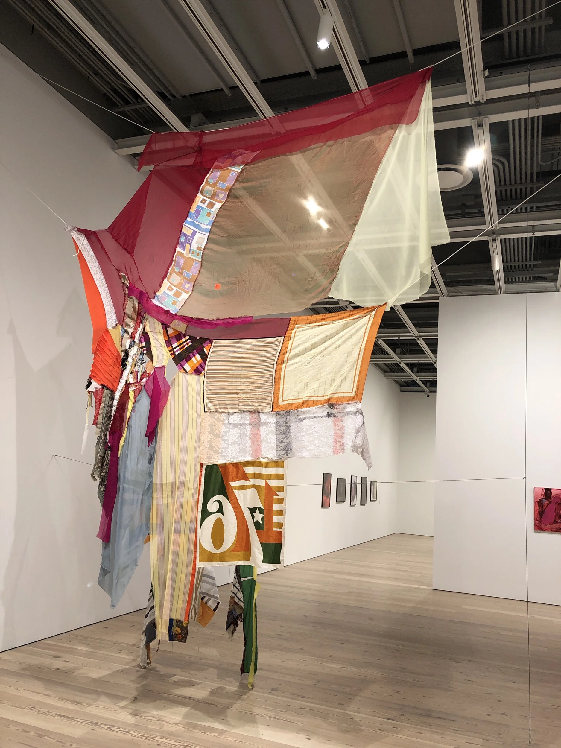 Eric N. Mack (Born 1987 in Columbia, MD. Lives in New York, NY) Proposition: for wet Gee’s Bend Quilts to replace the American flag-Permanently, 2019. While Eric N. Mack identifies as a painter, he rarely uses materials traditionally associated with painting and his work can also be viewed as a form of soft sculpture. His assemblages include used clothing and textiles, moving blankets, quilts, rags and other cloth based ephemera along with what he calls “everyday fragments” like newspapers, his own drawings, ropes, etc. Mack worked in his father’s discount clothing store when he was younger and through this experience gained an appreciation for the relationship between fashion and art, while also considering to what degree textile manufacturing depends on the underpaid labor of a mainly female workforce. In Proposition: for Wet Gee’s Bend quilts to replace the American Flag -Permanently Mack refers to the women of Gee’s Bend, a small black community in rural Alabama, who have created a well-known body of work consisting of quilts that are now exhibited in museums like the Whitney and the Metropolitan Museum of Art. Many of the textiles are purposely transparent so that you can see through the work and sense the space beyond it like a fragmented lens. The “76” echoes the “Don’t Tread on Me” in Pat Phillips piece: both reference flags of the American Revolution, which seems pertinent in our charged political atmosphere today, especially in light of the latest controversy over Nike pulling the Betsy Ross shoes. Mack’s work shares a banner like presentation similar to Jefferey Gibson’s, a sense of totemic power. Both are also exploring geometric abstraction using textiles as a celebration of identity. While Gibson is referencing the geometric aesthetics of Native American art, Mack is referencing the brilliant use of geometry utilized by the quilters of Gee’s Bend. This is the fourth reference to the American flag, providing either an alternative to the flag, a reference to historical flags dating from the American Revolution, or a rejection of the flag altogether. Conclusion The focus on identity, oppression, and resistance is typical for Biennials: this is the art we expect from a Biennial, it is a safely orthodox vision of America that is pre-approved by the cultural taste makers. Is this the new academic art? In the past you were not considered a serious artist if you were not depicting Greek mythology or scenes from Classical history. These were worthy topics because they spoke to the learned, people who came to the work knowing the references made by the artist. This is what made the Impressionists revolutionary: they depicted garden parties, haystacks, prostitutes, dance halls, and other subjects that did not require a long treatise to appreciate. They were castigated by the academy because these were not serious subjects that serious artists wrestled with. Does contemporary art have to be similarly serious and didactic to be deemed relevant? Does art have to teach you something? Does art have to “be” about something, can you feel with your eyes without needing a wall text to enlighten you? To paraphrase Paul Cézanne, there are sometimes feelings that you cannot express, it is better to feel them.
