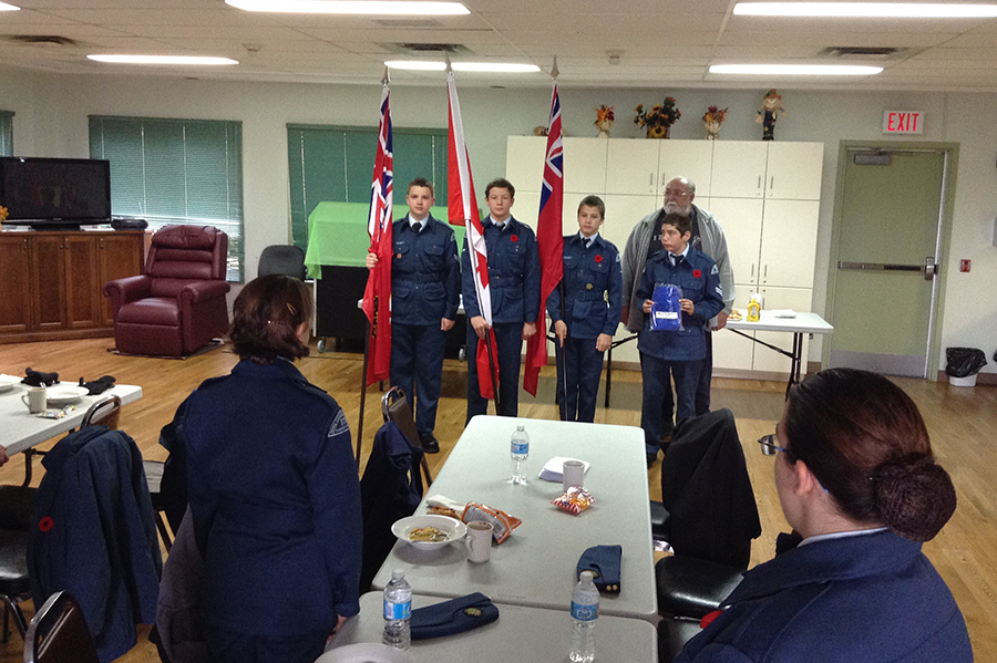 1 November 2014: President Patrick Golding presents new flags and poles to 379 Squadron Colour Party.