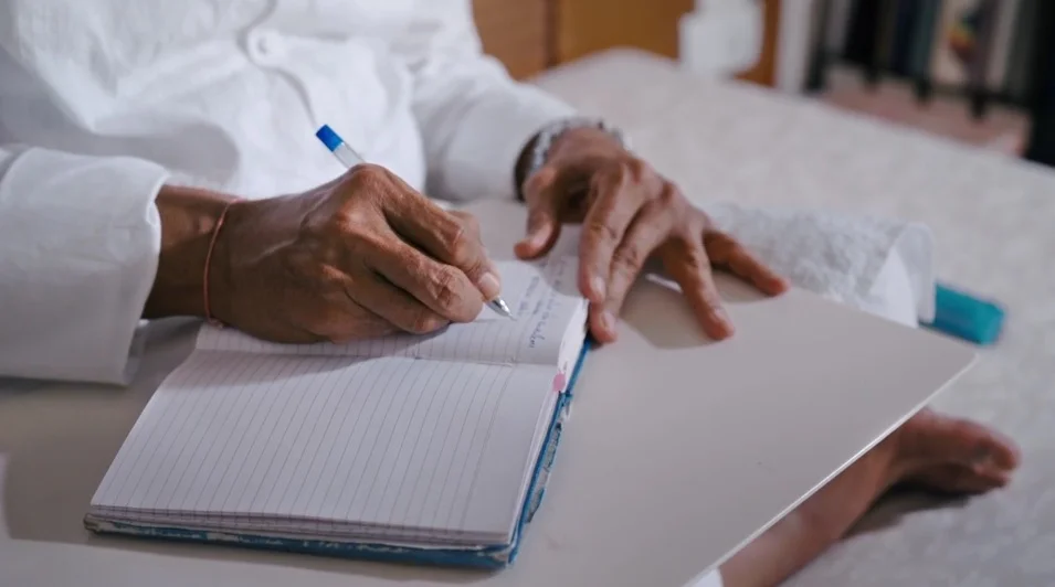Bhaishree writing his diary 2.jpg