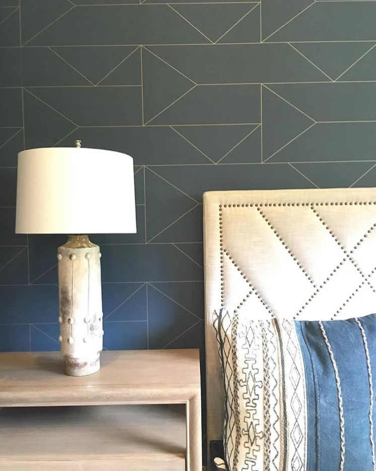 We have seen a trend in metallic shining through simple patterns and textures. This gold geometric outline creates dimension complimented by other geometric patterns in the space.