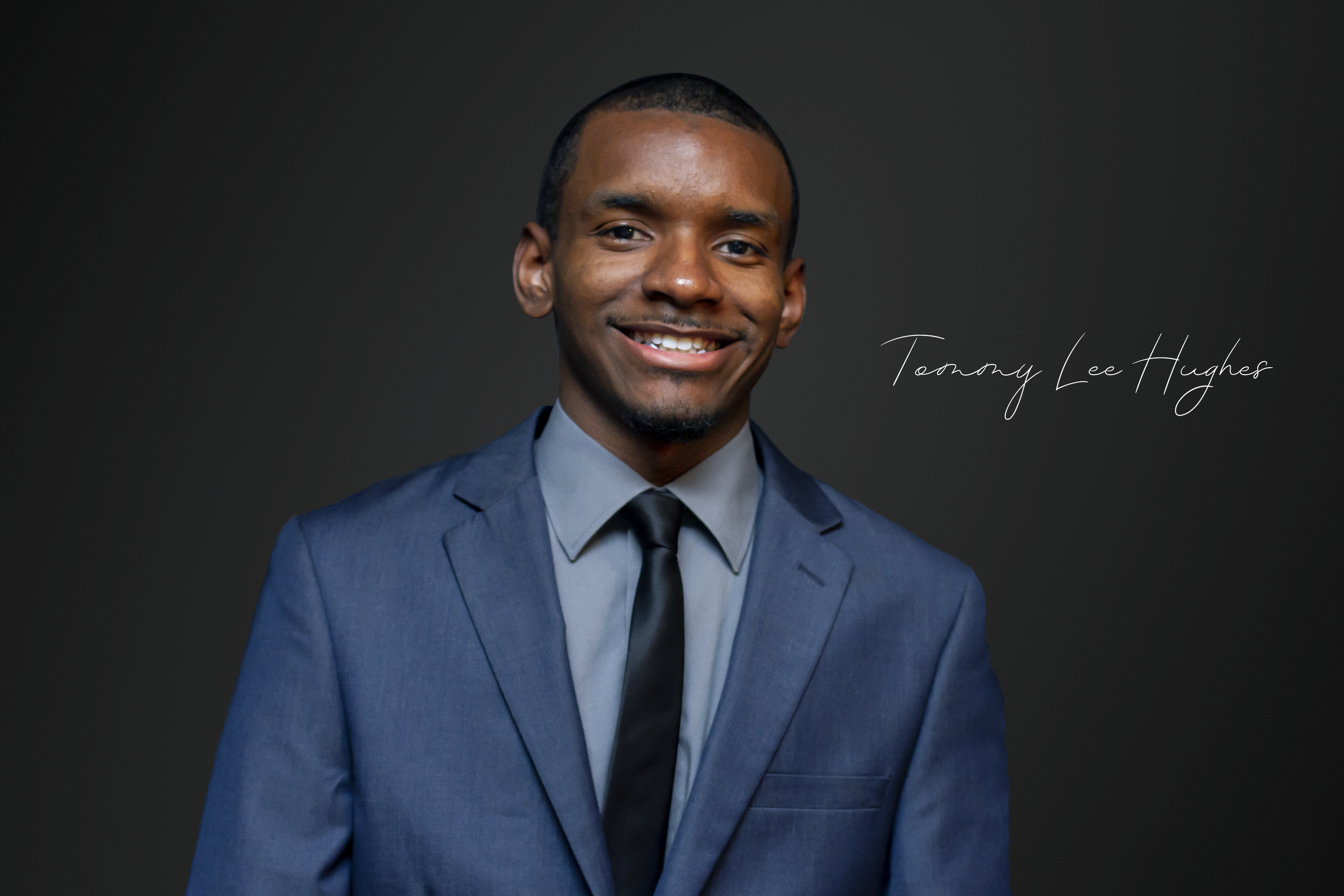 Tommy Hughes Headshot w_signature.png