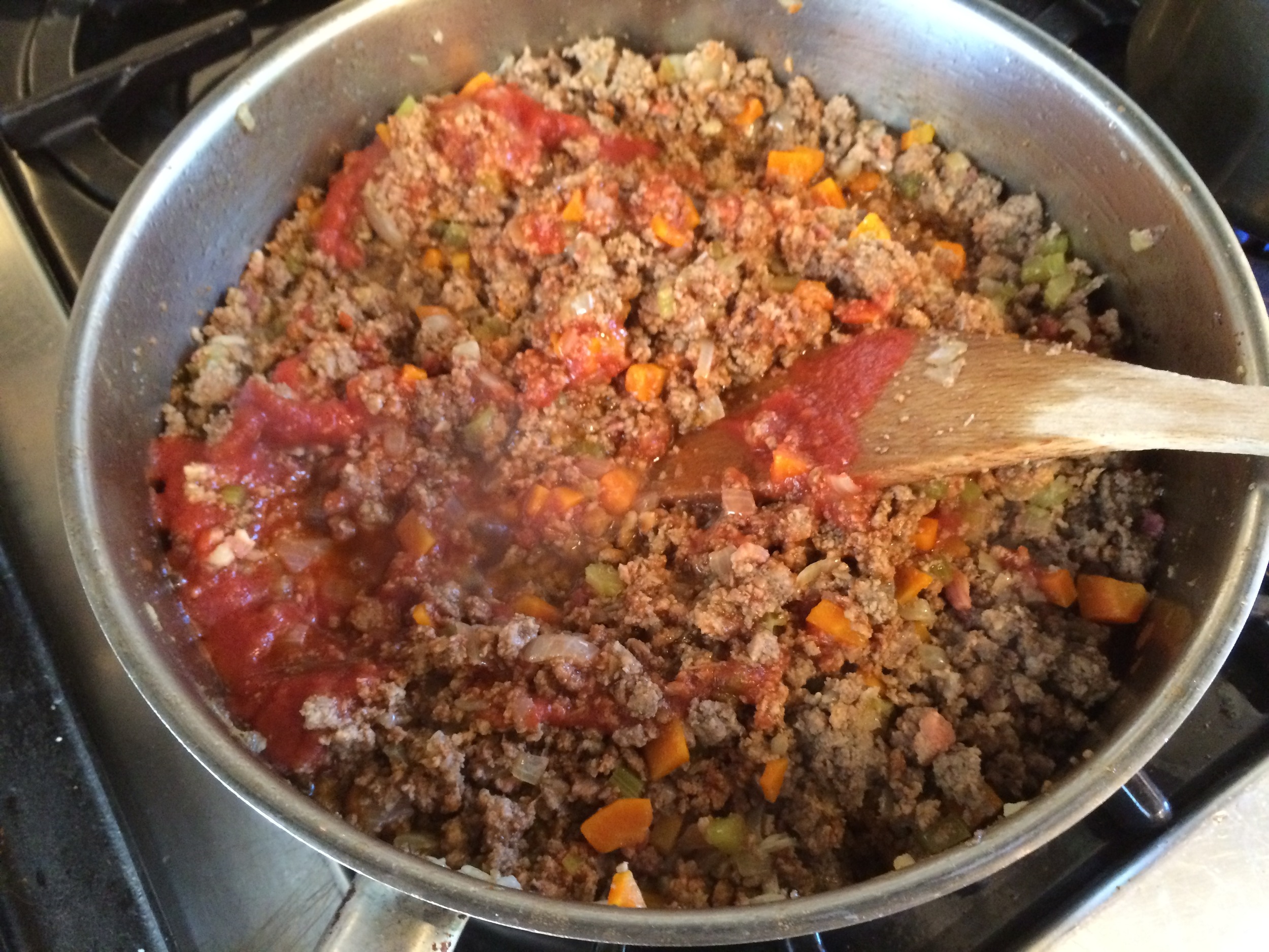 Adding the tomato sauce