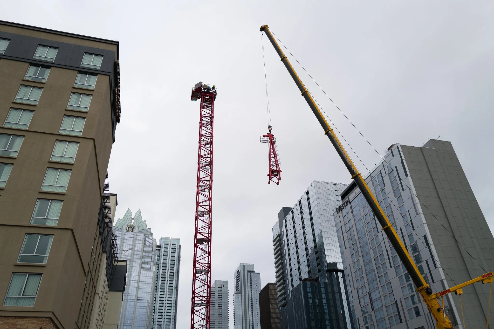 Crane being constructed in downtown Austin, Texas to start building a new tower.