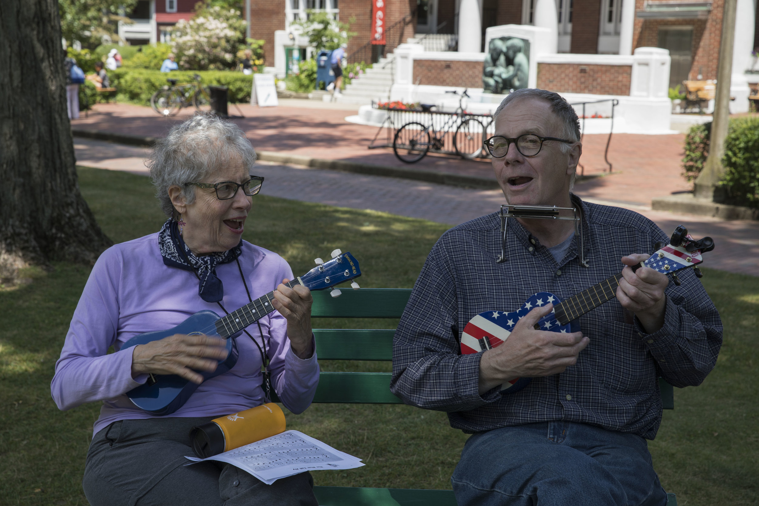  Bobby Nehman, right, teaches Dean Johnson how to play "The Blue Tail Fly" on the ukulele on Tuesday, July 18, 2017.&nbsp; 