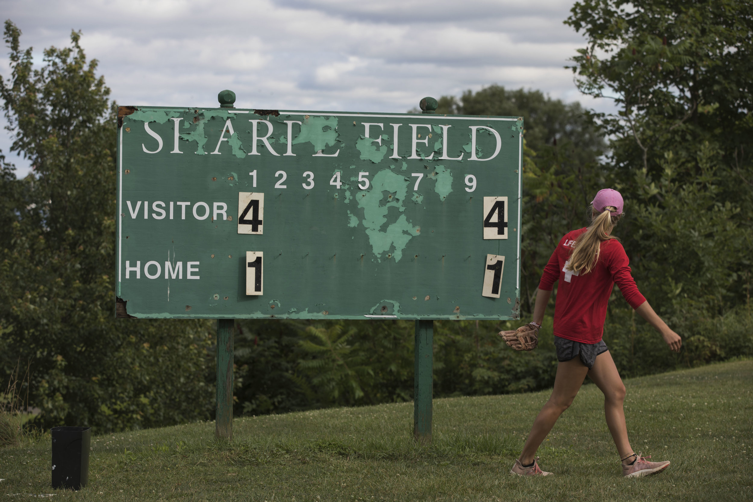  Gillian Lawton, member of Grilled Cheeselers softball team changes the scoreboard after the first inning of the playoff game against The Belles on Tuesday, July 25, 2017 in sharpe field. The Grilled Cheeselers won 29-8.&nbsp; 