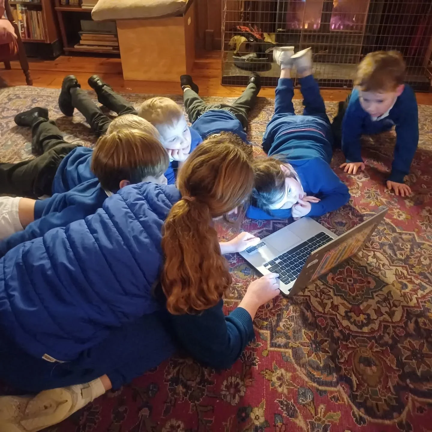 The Year 6 children have been busy writing stories and illustrating them using AI. Today they have shared their stories with the other children in the school. Here are some of the children sharing their stories with Kinders and Infants by the Christm