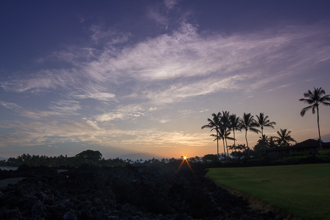 Sun rising in the cradle of the volcanoes at Kaʻūpūlehu