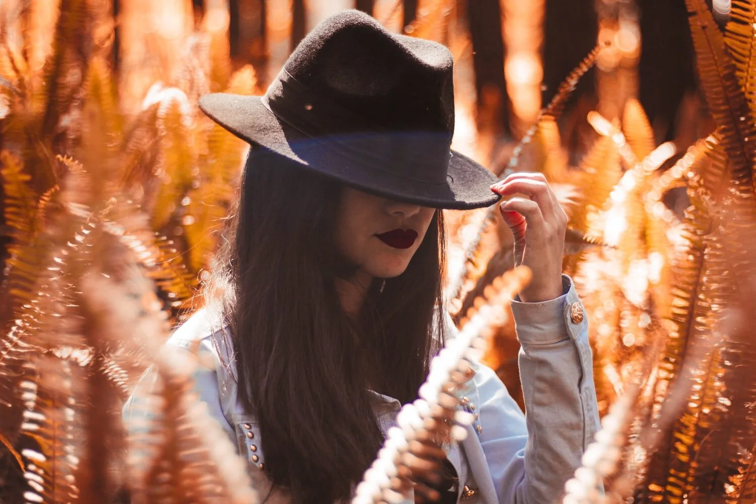 model with hat and orange background.jpg
