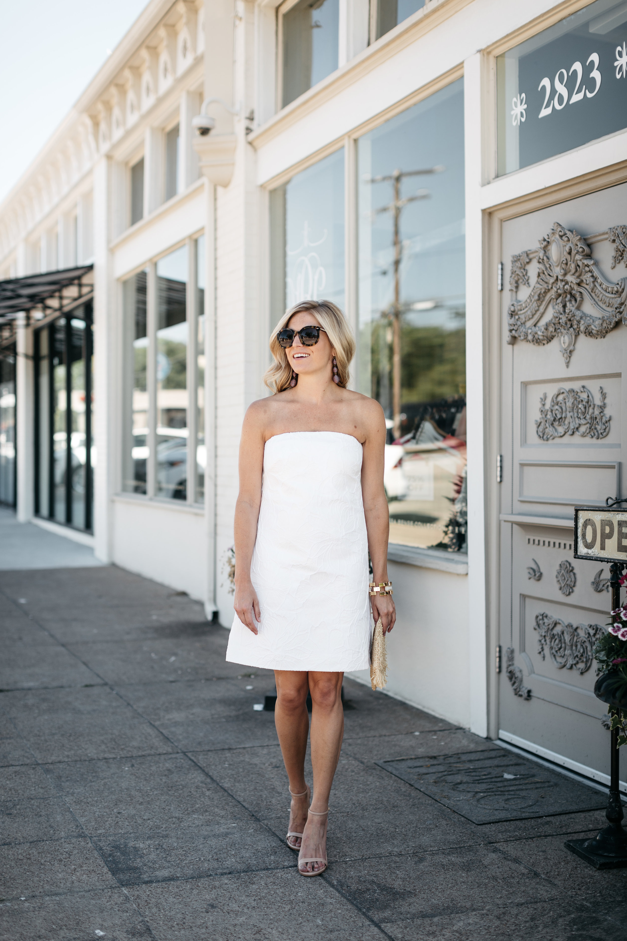 One Small Blonde | You can tell how bright it was outside, but we found a strip of sidewalk that was completely shaded from the building. The sun was in front of Brooke, so she was facing the light, making a clear, evenly-lit photo