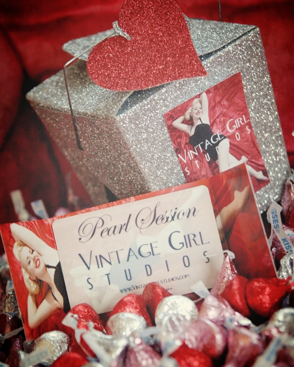 Around this time of year I get many phone calls from significant others looking to purchase a gift certificate for their sweetie. Sometimes they are unsure of what we do and sometimes they know exactly! Please know that here at VGS we are passionate about Vintage Glamour/Pin-up photography and we strive to do our best to make sure clients have an amazing experience and a lot of fun. They will be in good hands. I have put together a FAQ.   1. What happens when I purchase a session at VGS for my sweetheart?   She can contact us at anytime via email or phone to schedule her session. Even if it is a year away we will still honor all prepaid sessions.  We start our communications where they can come in for a consultation or via email/phone. We ask them questions, we will have provide a link to our wardrobe, and they will have instructions from our stylist.  On the day of their session we will give them our attention in styling, wardrobe, and posing instruction for an amazing experience.   2. What makes your gift certificate special?   We understand that finding time to wrap a gift can be hard. Our gift certificates include a box of chocolate kisses. We will ship or have the packages for pick up in our Rhode Island studio.   3. Would I be able to attend the session?   It is up to your sweetie. Please know that our studio is two rooms. One for dressing and the other is for MUAH/ photo studio. If she does not mind having you there we do not either.      For more info contact us at 617.504.9087 or vintagegirlstudios@gmail.com