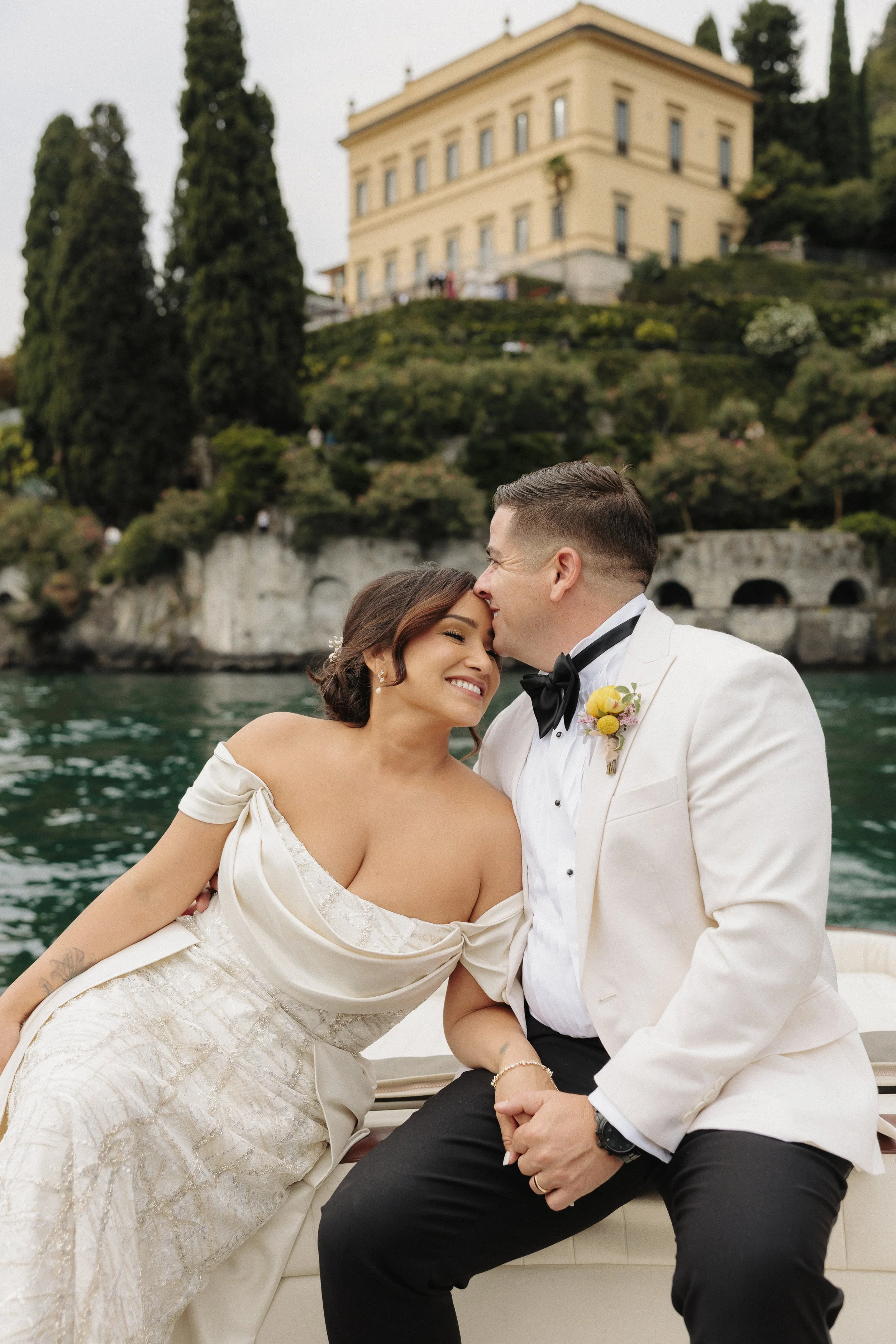 Bridal portraits on a boat in lake como italy during a luxury wedding