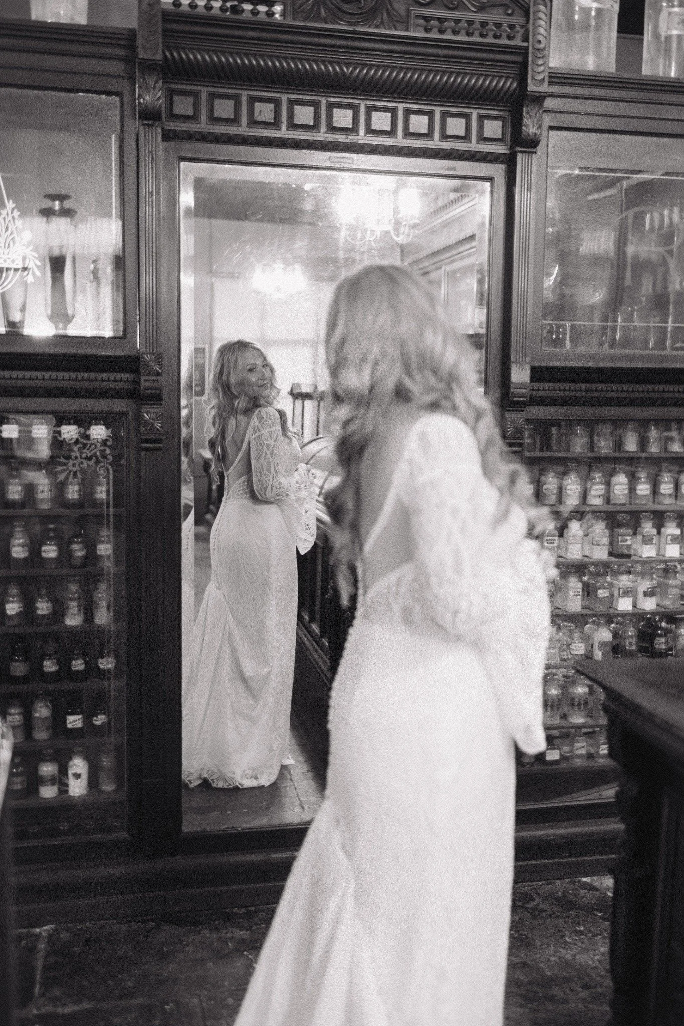 Black and white bridal portrait inside the New Orleans Pharmacy Museum
