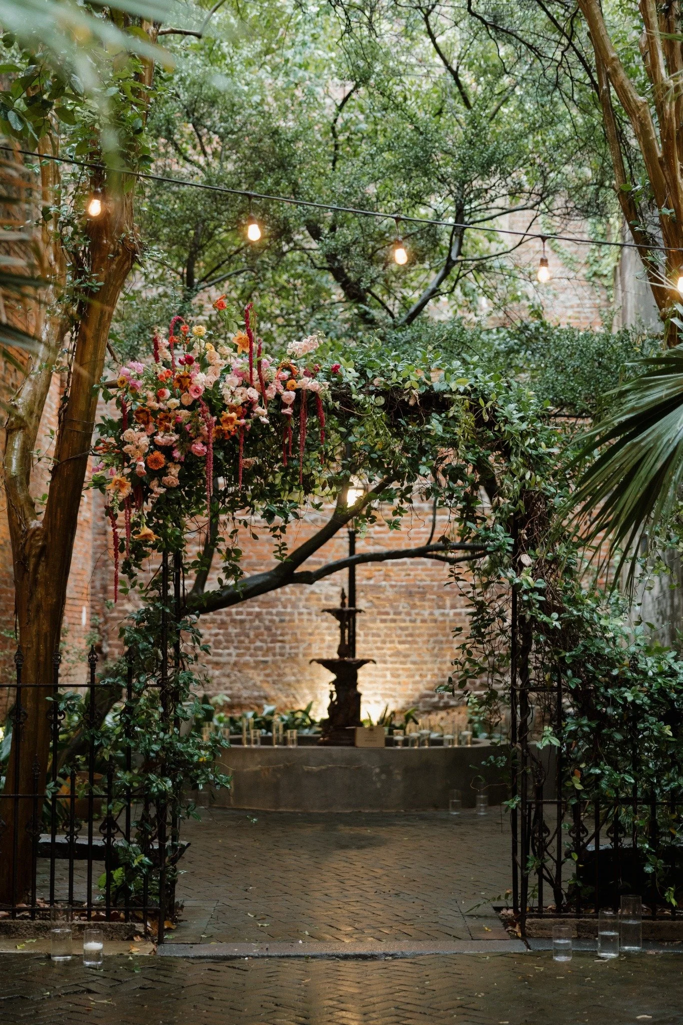 Floral ceremony arch in the New Orleans Pharmacy Museum courtyard