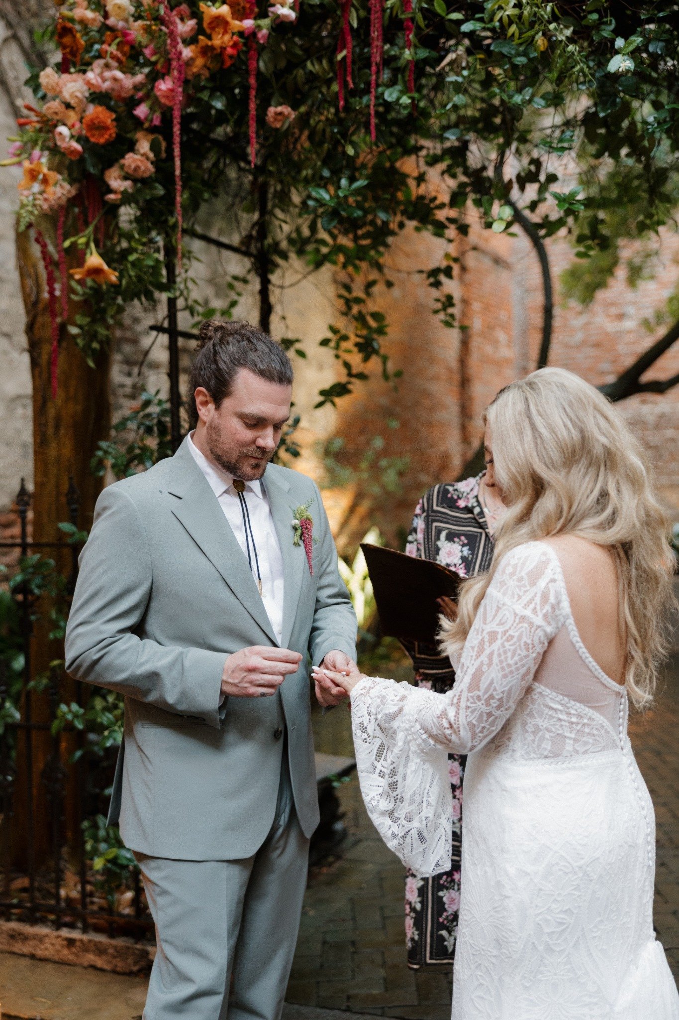 Austin placing Haley’s wedding ring during their New Orleans elopement