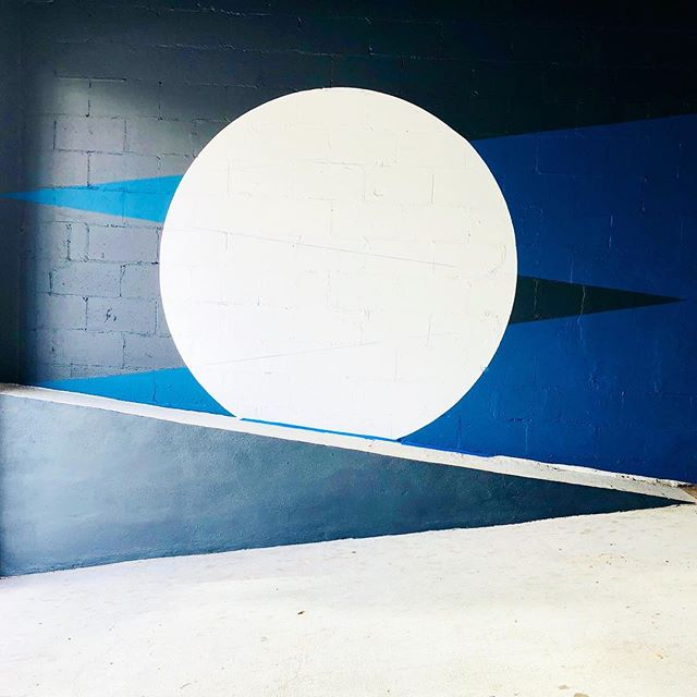 New #mural in the Channel District. Day 1 progress. 
Any guesses where it&rsquo;s at? 🧐🎨 #tada #graphicdesign #channeldistrict #art #downtowntampa #geometric #triangles #workinprogress #tampamurals #artistlife #tampamuralpainter #keepmovingforward 