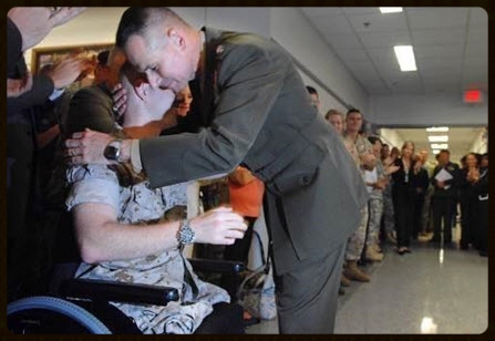 General Peter Pace, USMC (Ret.) and with a wounded warrior