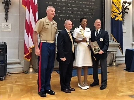 Captain James F. Brooke, III Memorial Division of Humanities & Social Sciences Award: Midshipman 1/c Cara M. Edwards, for her paper “Navy Shipbuilding Programs and Force Structure: Achieving a 355-Ship Navy.” Joining RADM Loren and the award recipient in are Naval Academy Academic Dean and Provost Dr. Andrew T. Phillips and Chair of the Humanities and Social Sciences Division Colonel Jon Aytes, USMC.