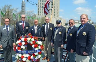 Naval Order Companions with wreath aboard the USS Olympia.