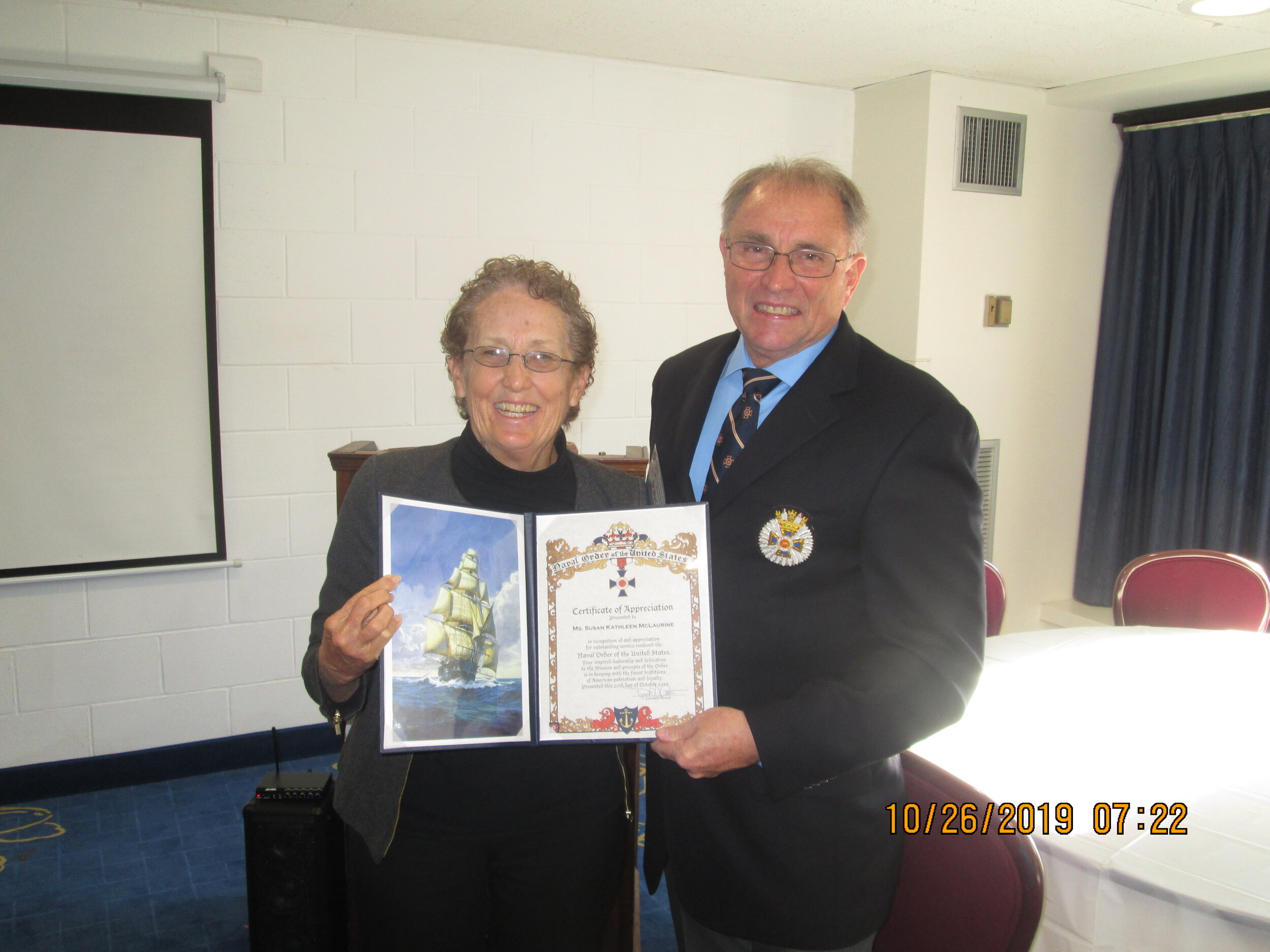  Treasurer General Susie McLaurine receiving a Certificate of Appreciation. 