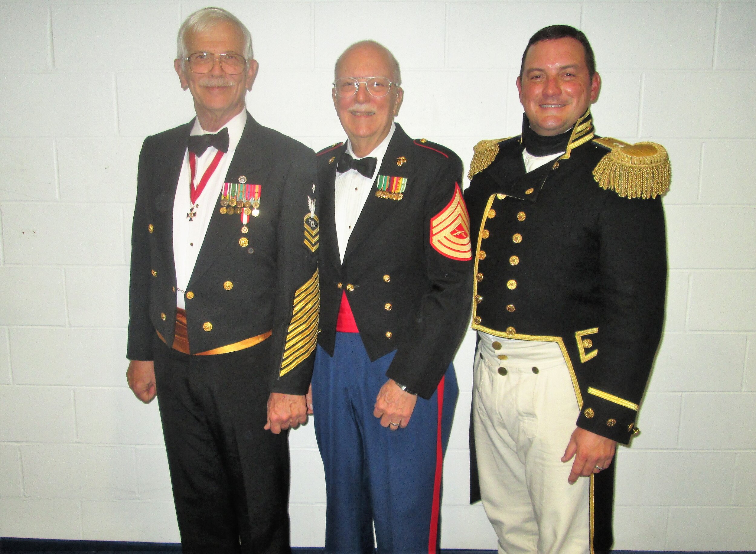  MCCS Bob Hansen, USN (Ret.), MSgt Tom Gafford, USMC (Ret.) and CDR Nathaniel R. Schick, USN, the Commanding Officer of the USS&nbsp; Constitution &nbsp;in 1804 uniform 