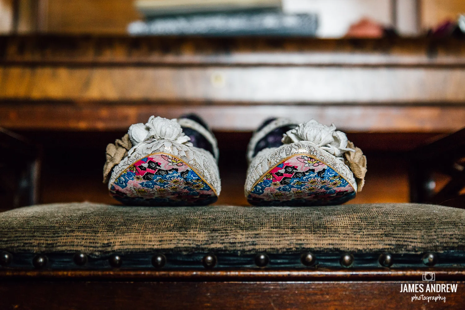 Alternative wedding shoes on bench colourful soles