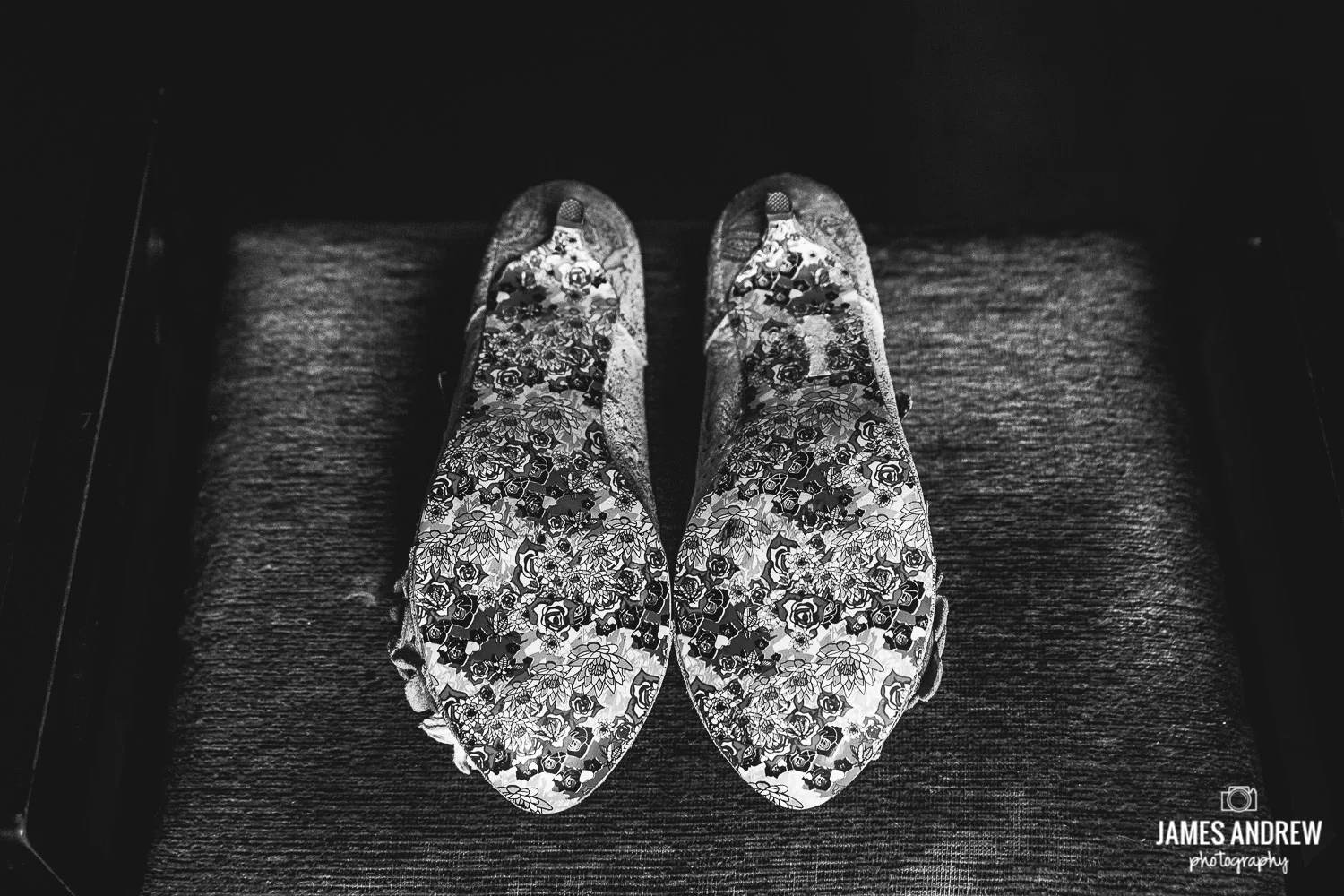 black and white picture of wedding shoes