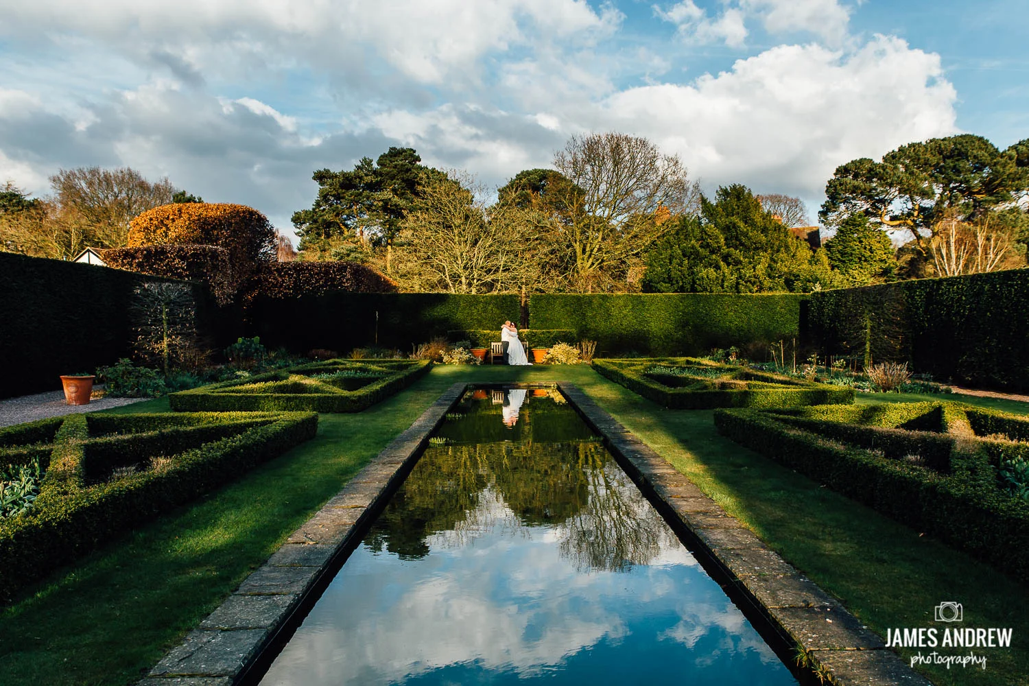 bride and groom shot over water reflection