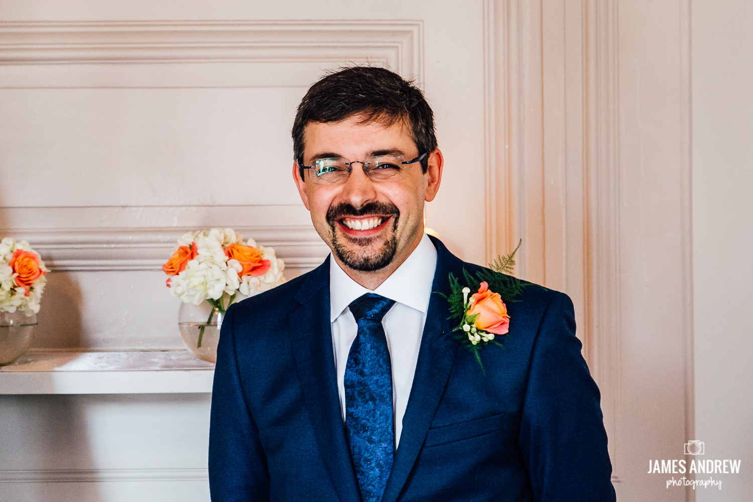 Groom smiling waiting for bride to arrive