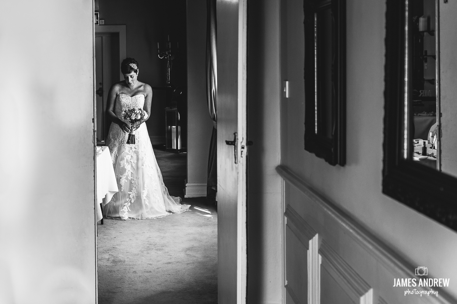 Bide through doorway waiting to walk down the isle