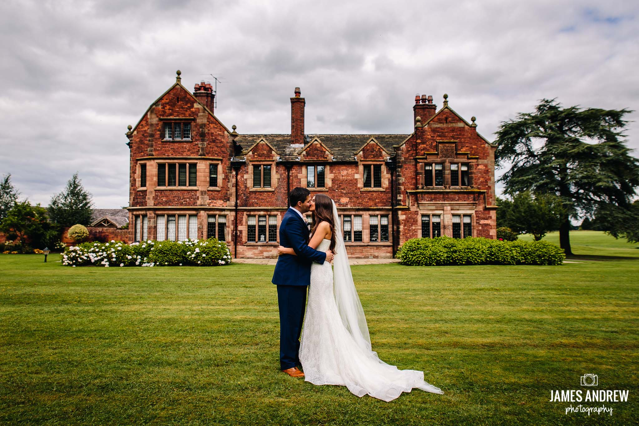 Colshaw Hall Bride And Groom Portrait in front of statley home manor house