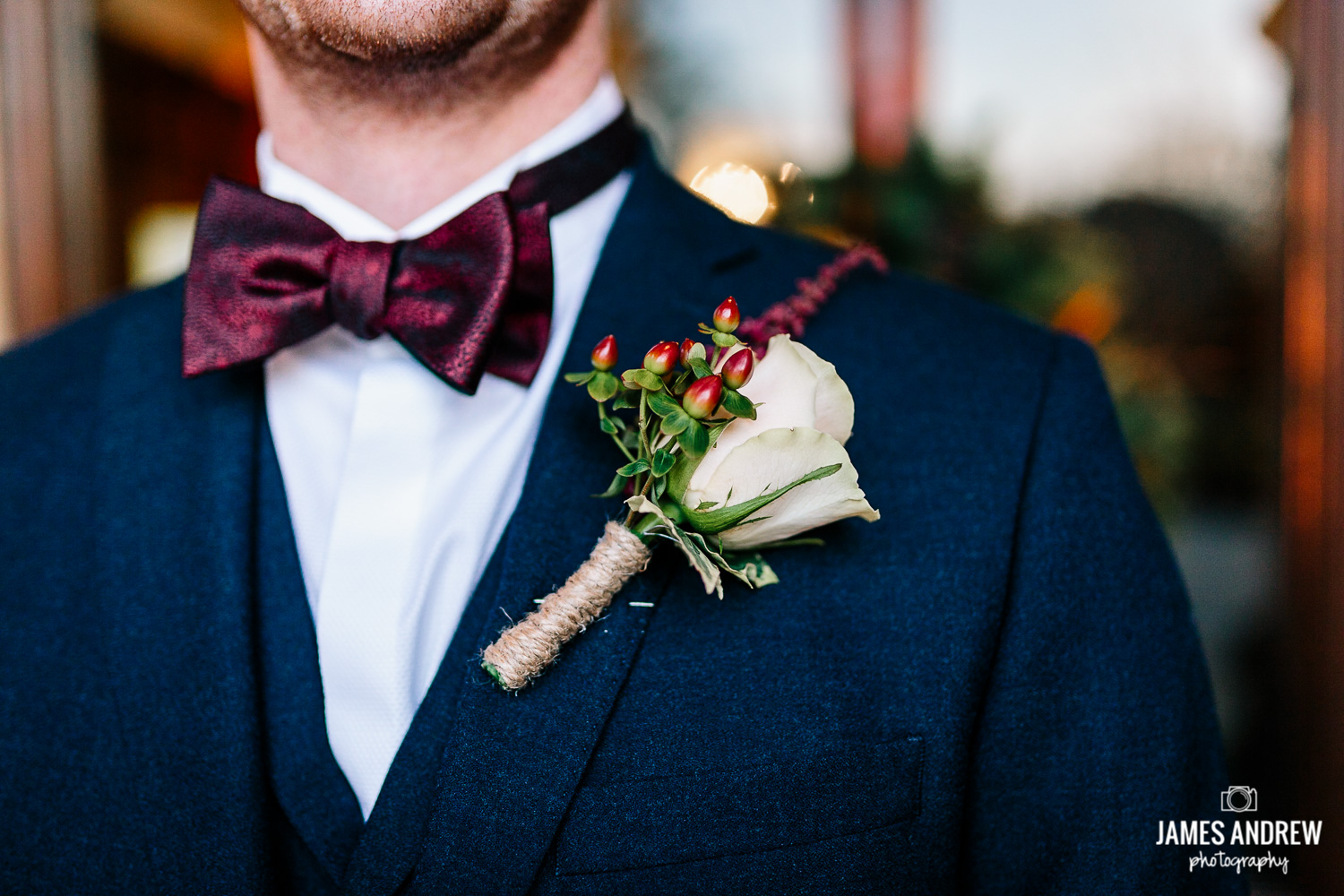 Grooms winter bow tie and button hole
