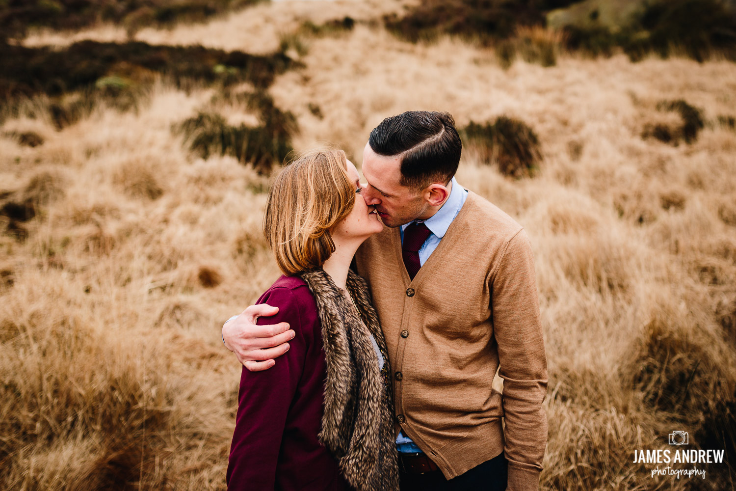Engaged couple kissing Peak district