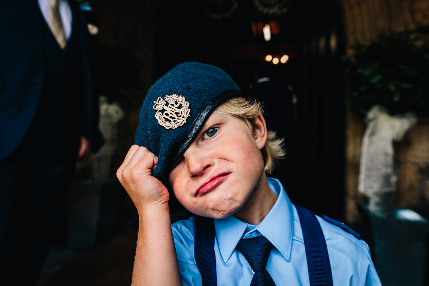 Kid pulling funny face at wedding