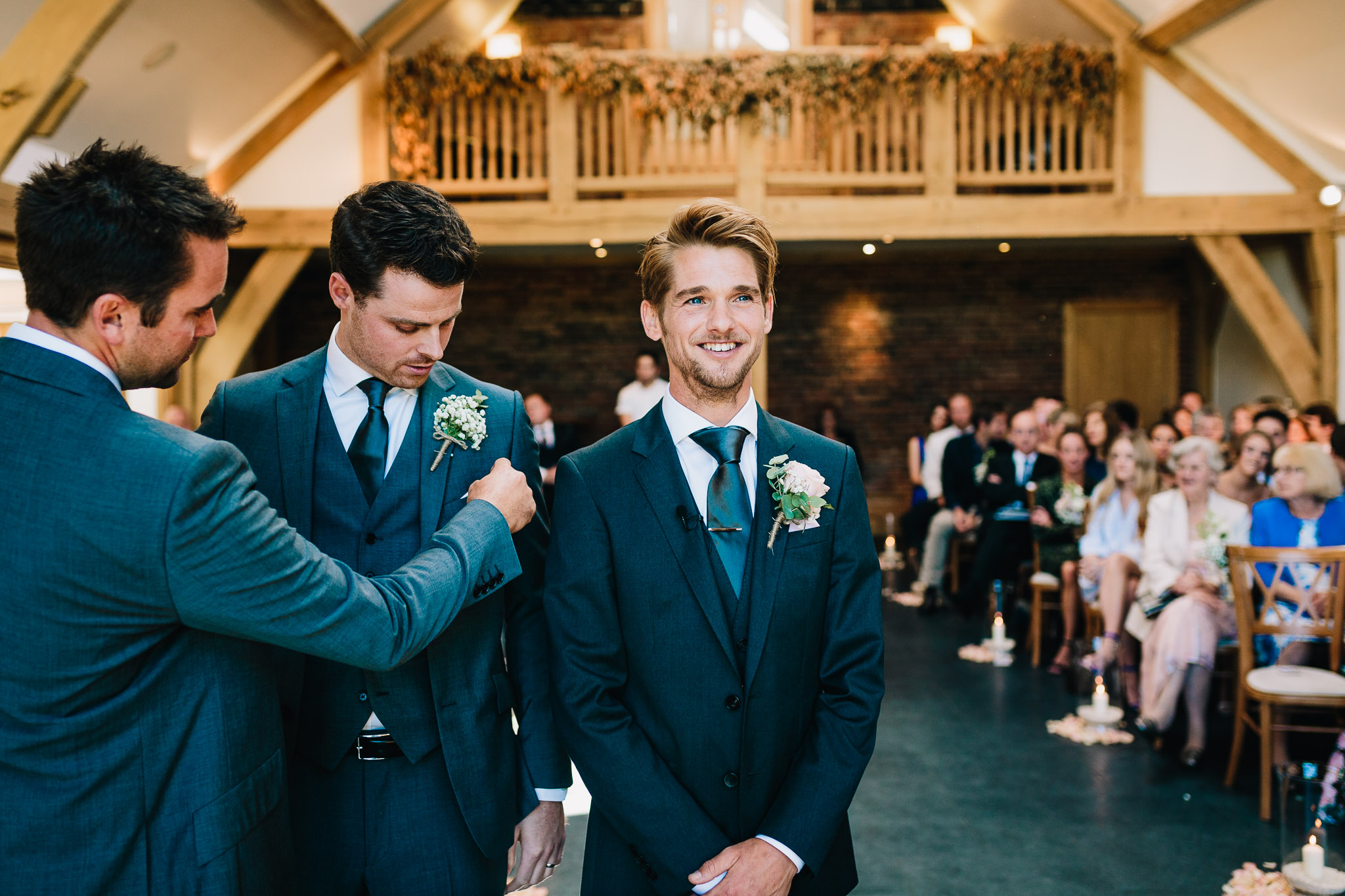 GROOM WAITING FOR BRIDE AT WEDDING CEREMONY