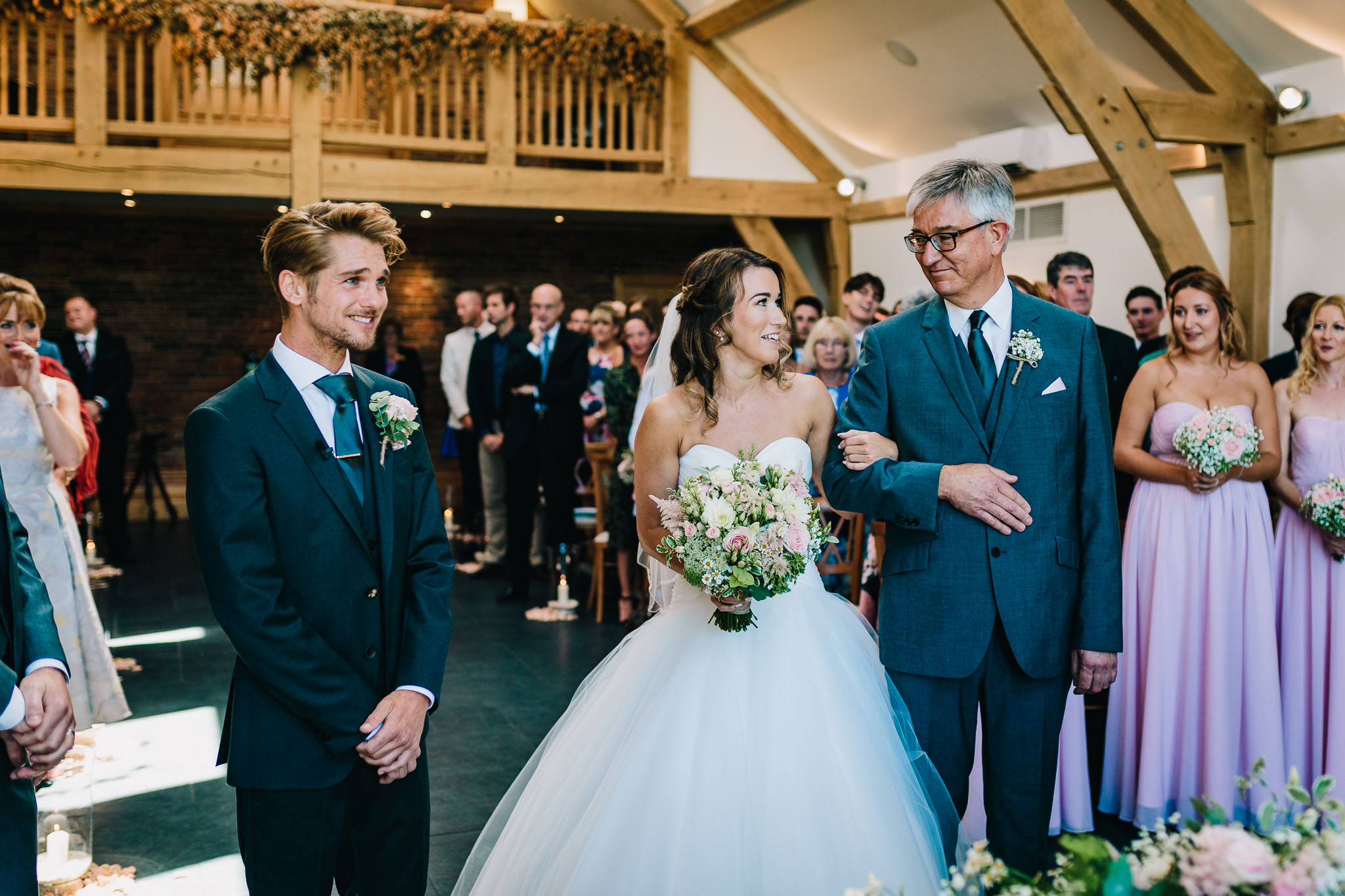 FATHER OF THE BRIDE LOOKING AT DAUGHTER BEFORE GIVING HER AWAY