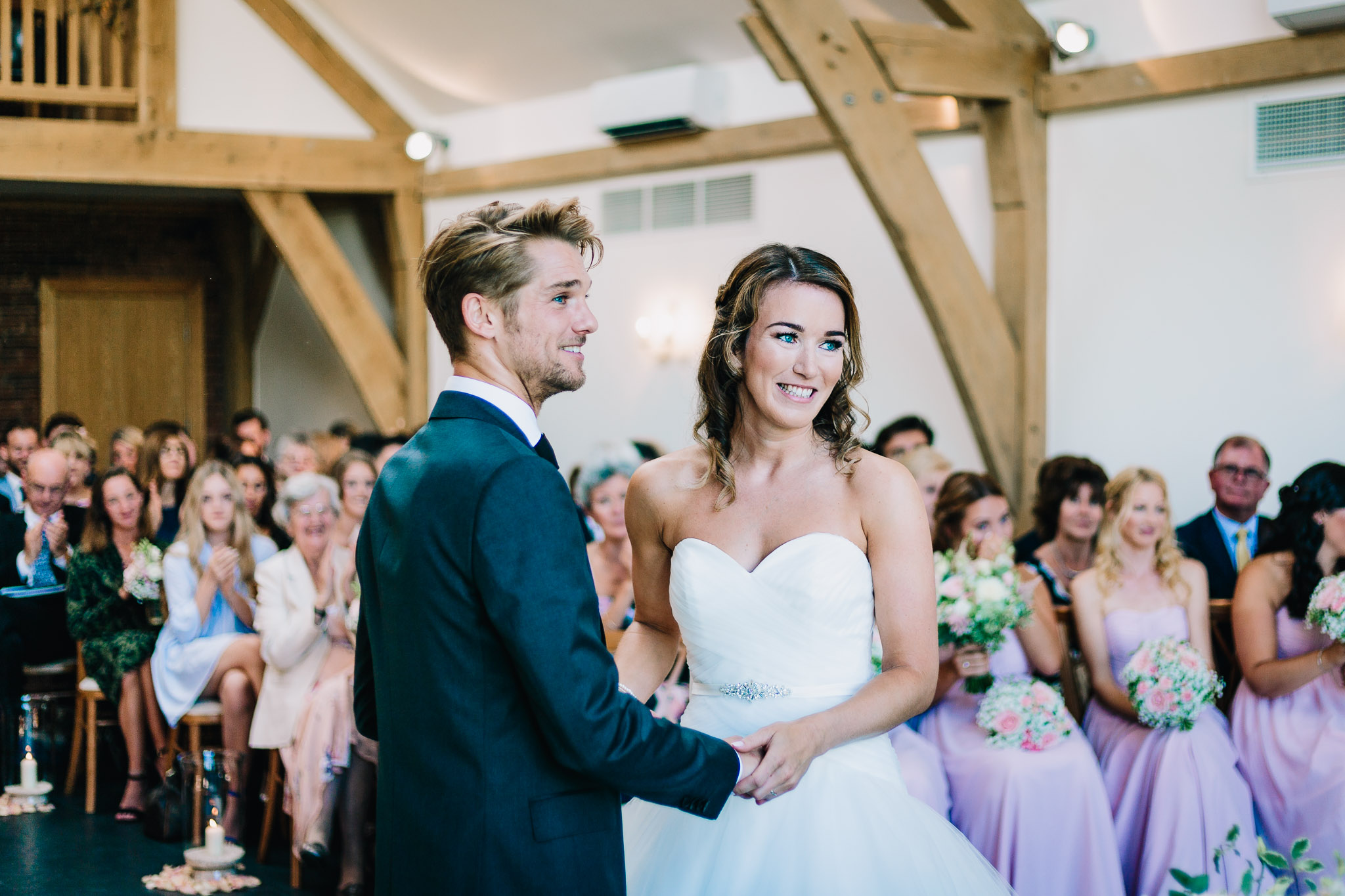 JUST MARRIED BRIDE AND GROOM AT MYTHE BARN