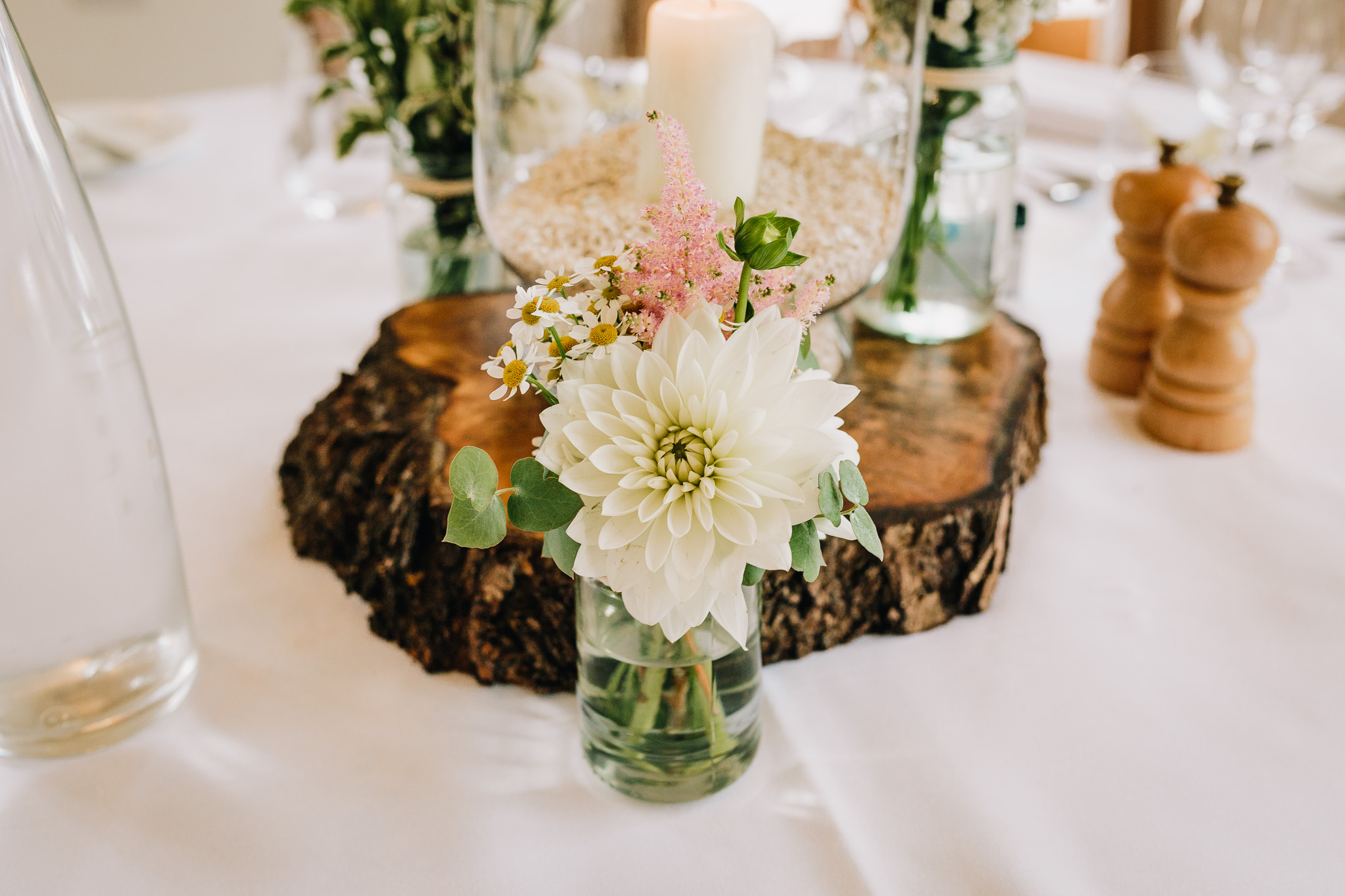 RUSTIC WEDDING FLOWERS ON TABLE AT RECEPTION