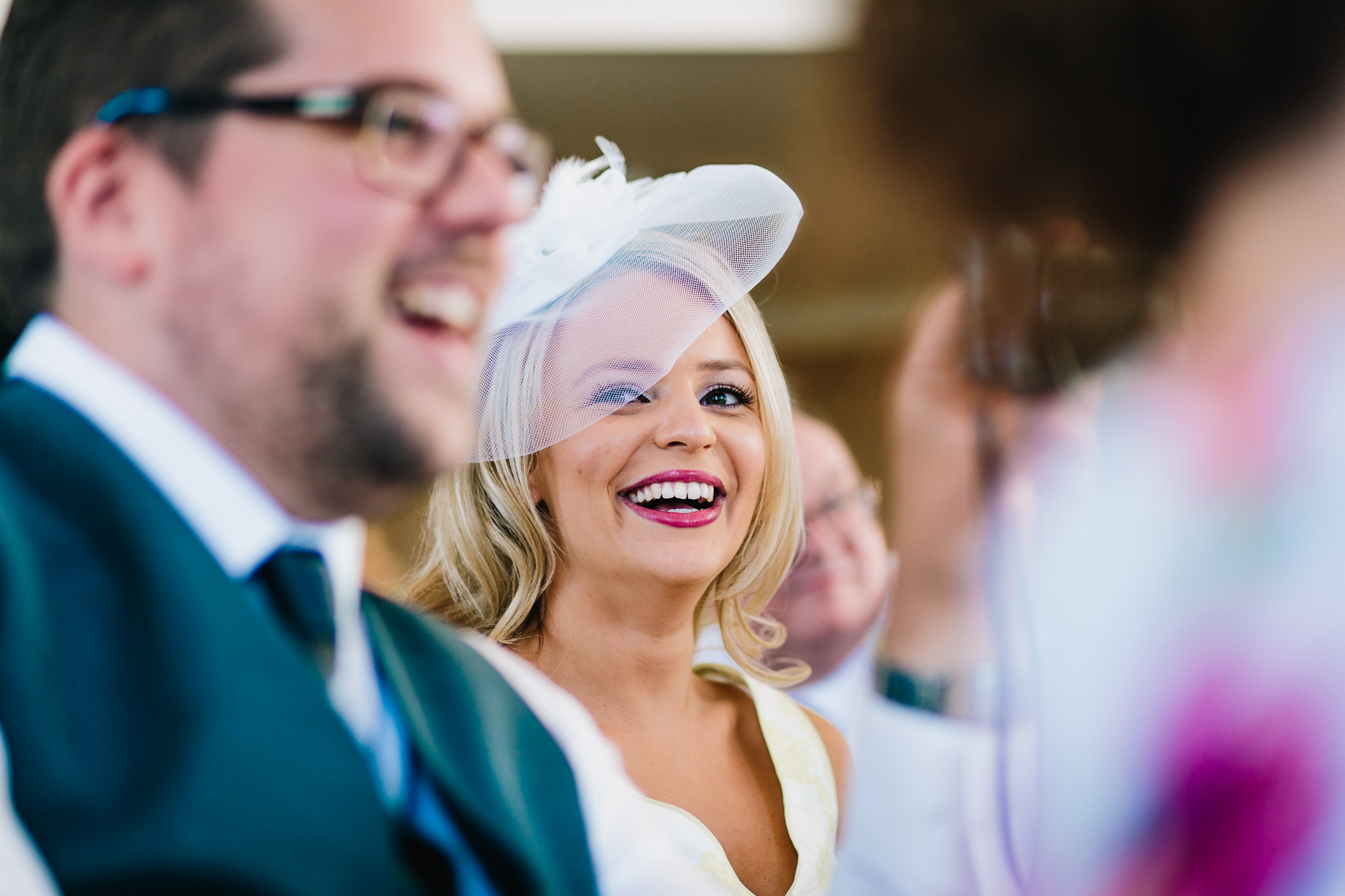 CANDID NATURAL PICTURE OF WEDDING GUEST LAUGHING