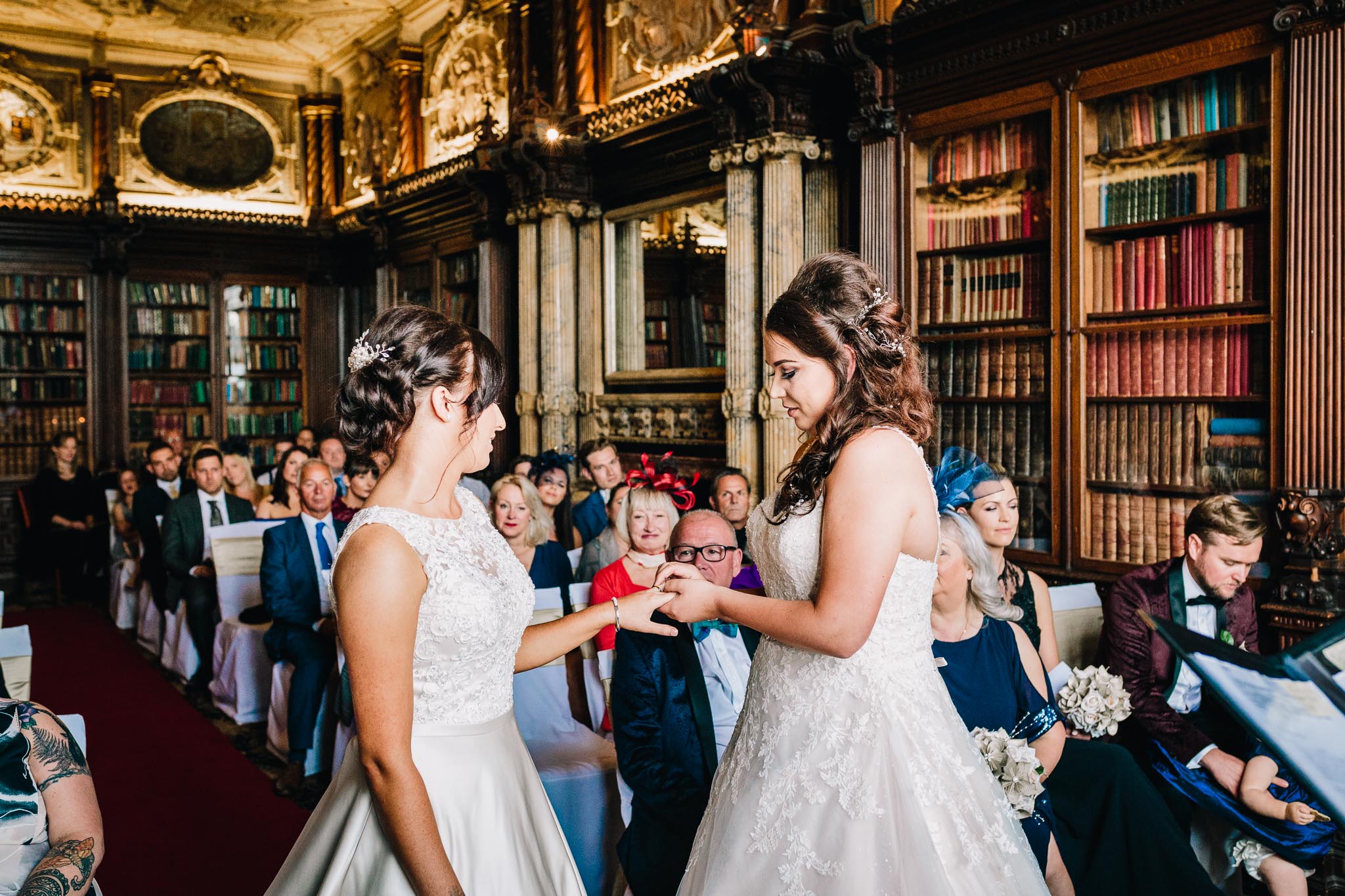 BRIDES EXCHANGING RINGS GAY WEDDING