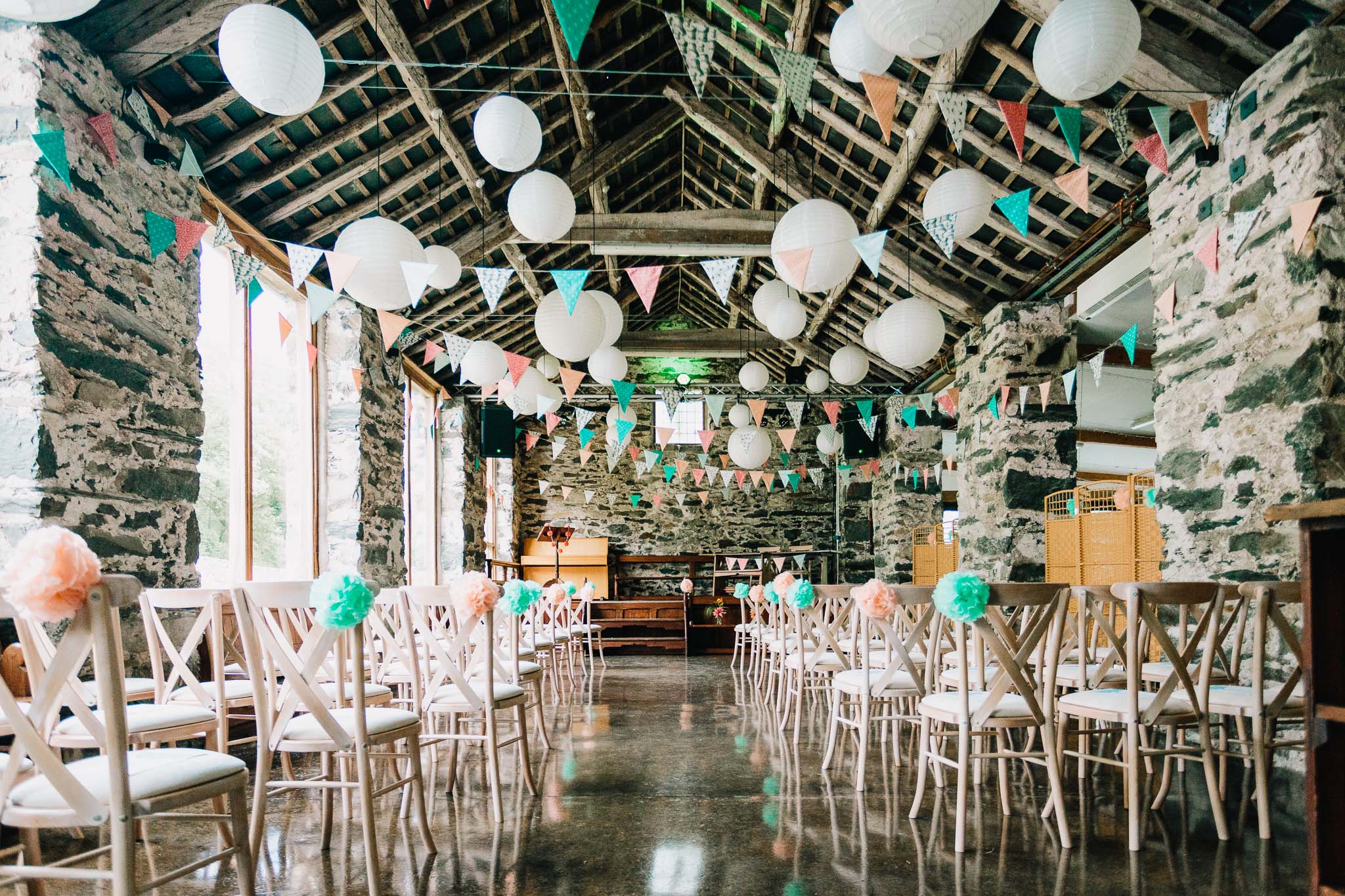 LLYN GWYNANT STONE BARN DECORATED IN PASTEL BLUE AND PINK FOR A WEDDING