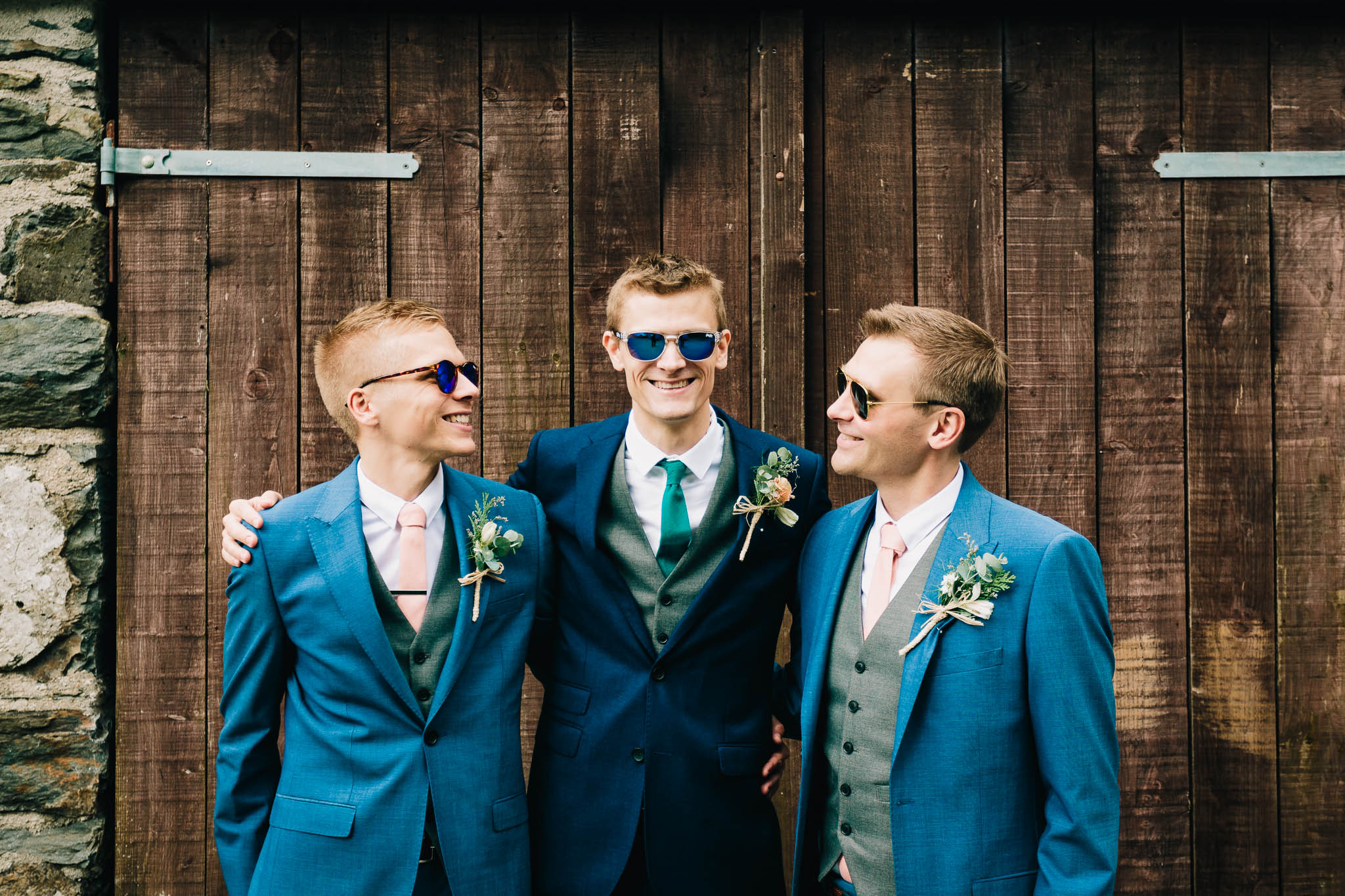 GROOM POSING WITH GROOMSMEN WEARING SUNGLASSES