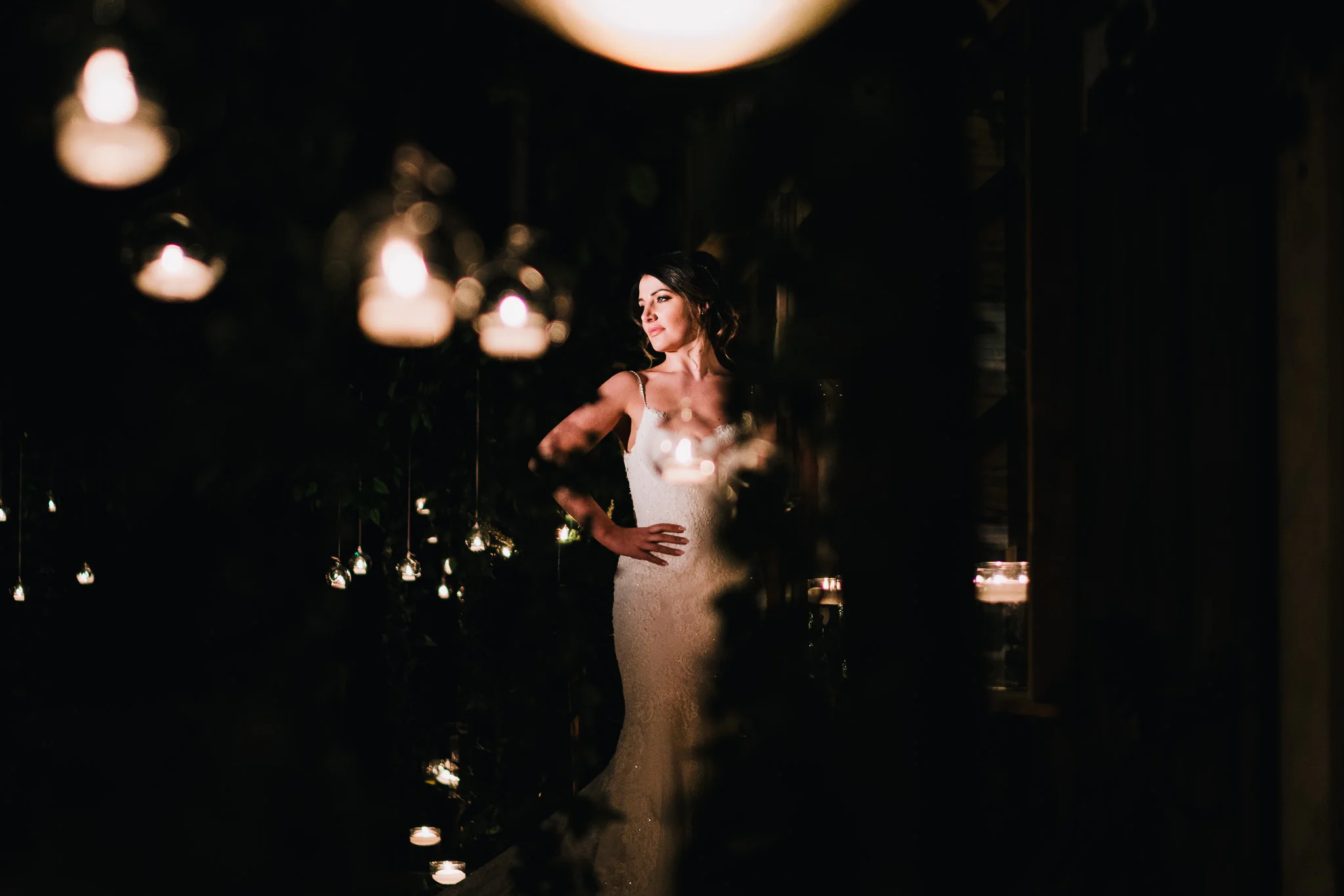 photo of stunning bride at night time with bokeh at owen house barn venue
