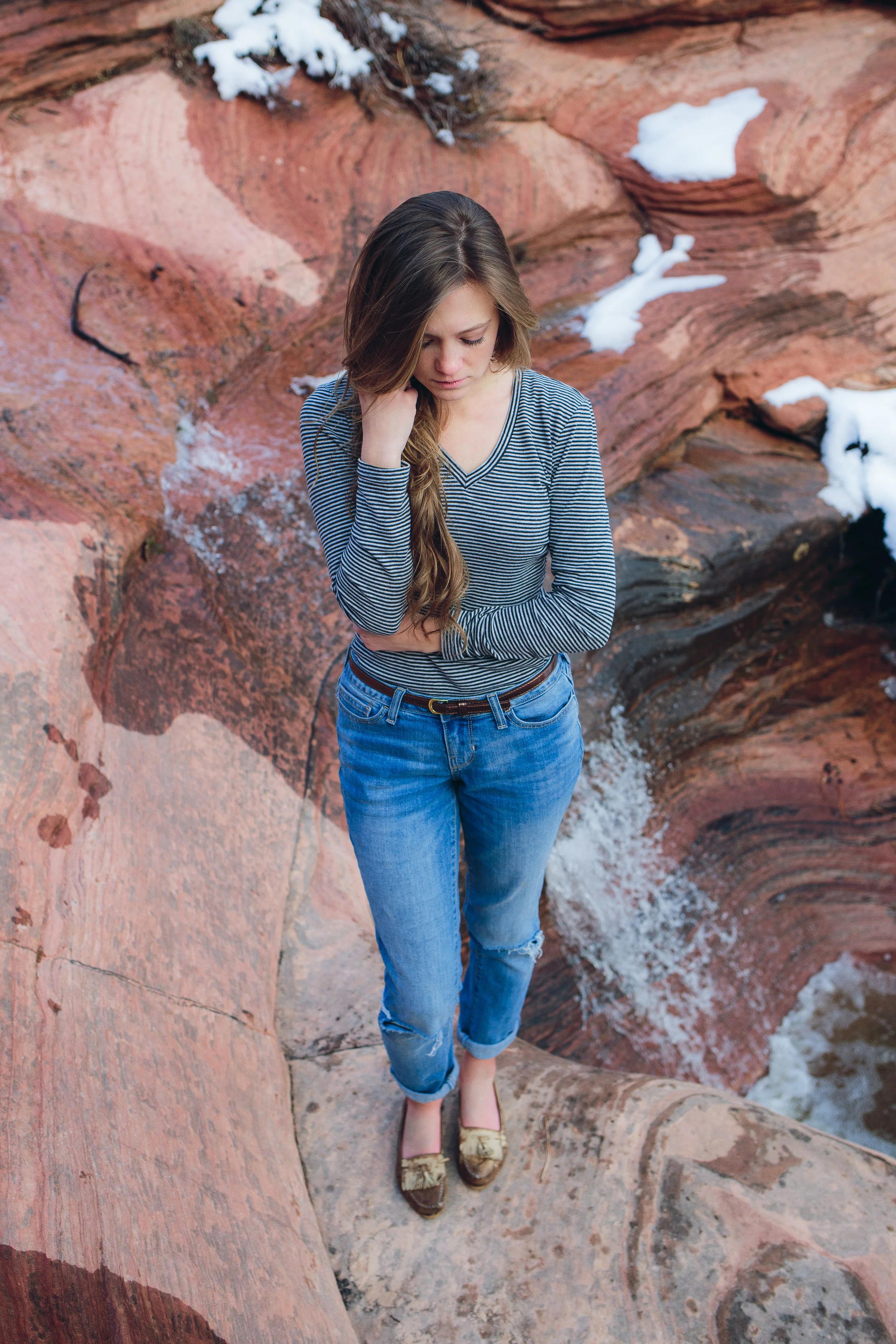 Beautiful girl in Zion red rock water fall