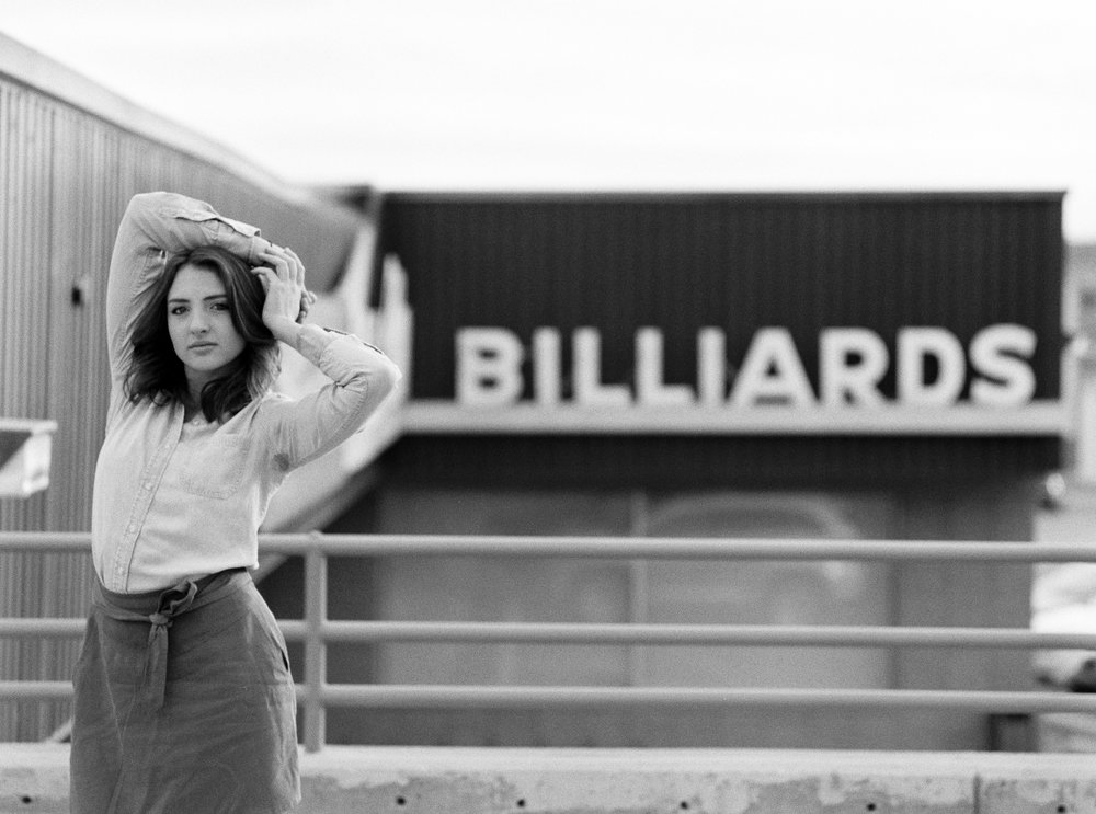 Black and white film billiards neon sign urban portraiture