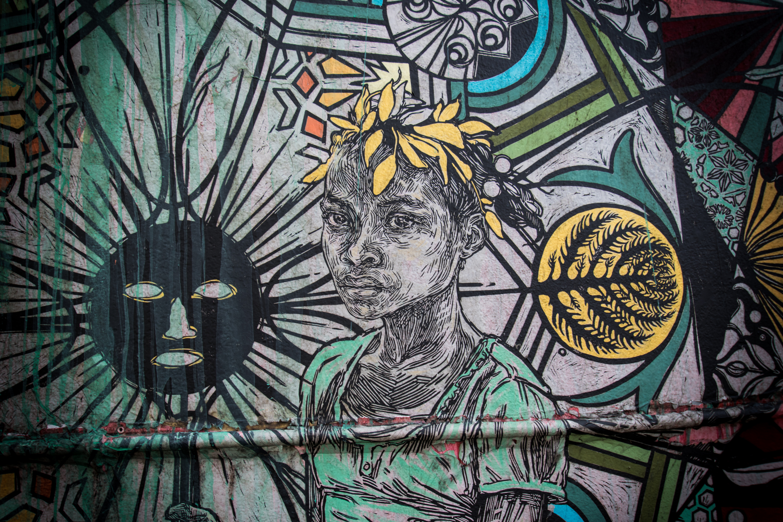 A detail from the massive wall by Swoon from Brooklyn, NY, USA