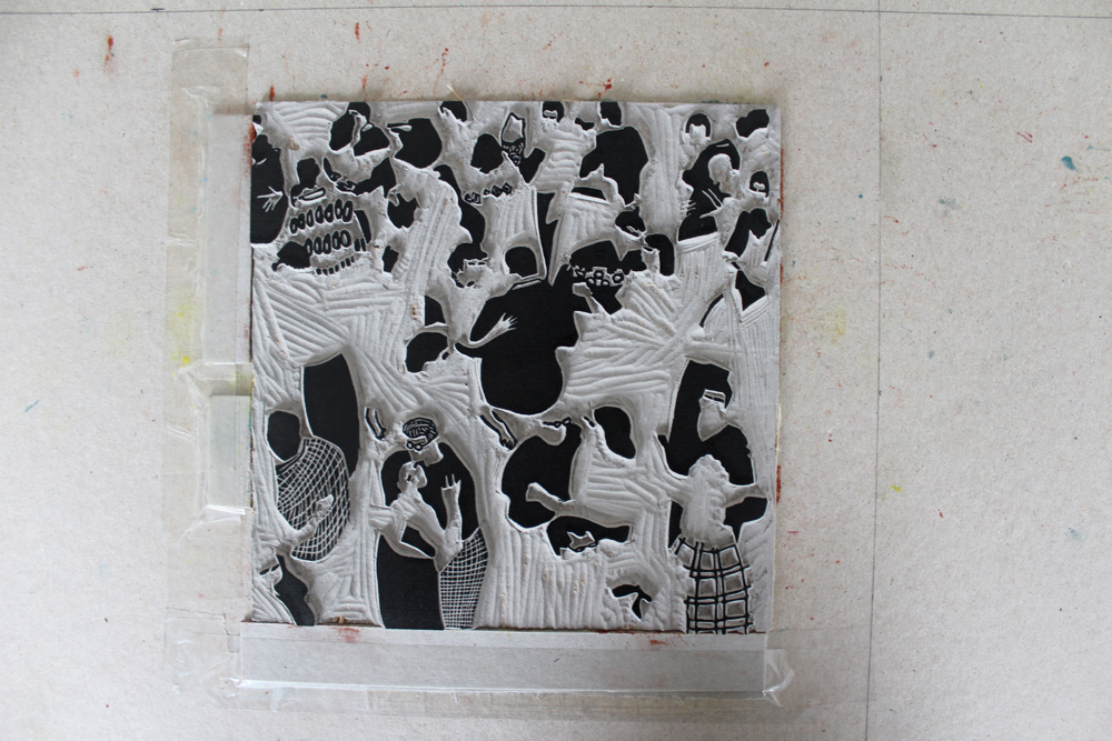 Placing the inked up block on the registration board